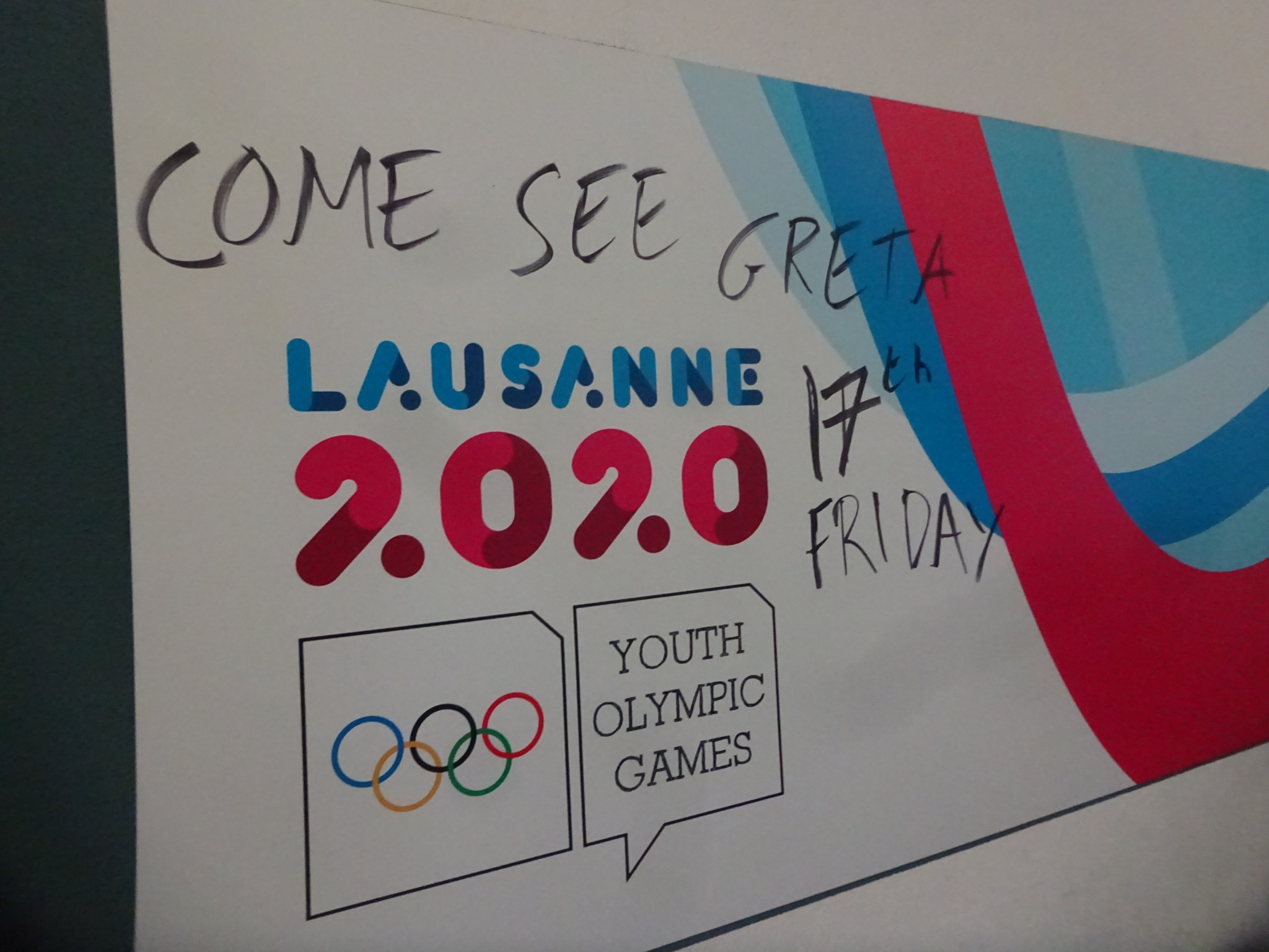 Graffiti on a Lausanne 2020 sign notes Greta Thunberg's expected arrival ©ITG 