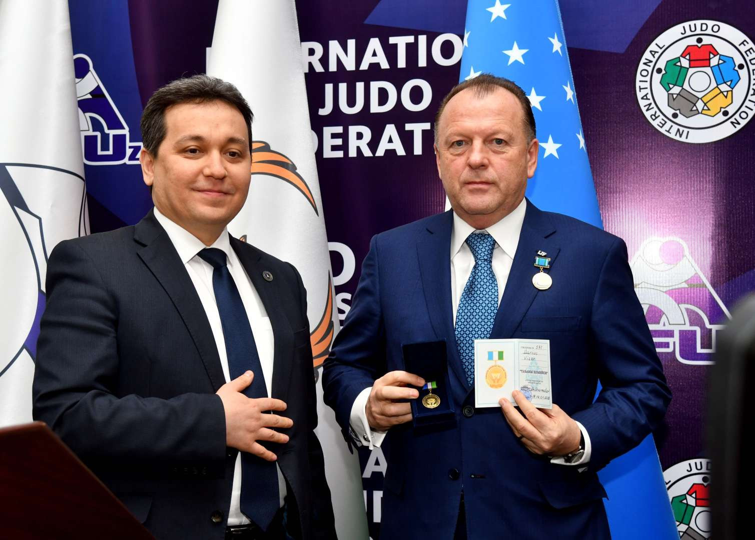 IJF President Marius Vizer, right, was awarded the Award of Sponsor of Education by Uzbekistan's Education Minister Sherzod Shermatov after announcing an expansion of the 