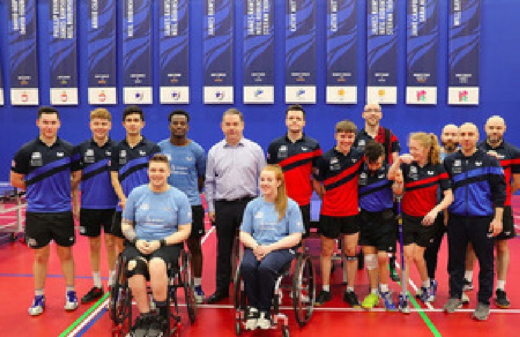 British Sports Minister Nigel Adams, pictured with members of the country's wheelchair basketball and Para table tennis teams, has announced that the Paralympic Games will remain on free-to-air television in the United Kingdom ©UK Government 