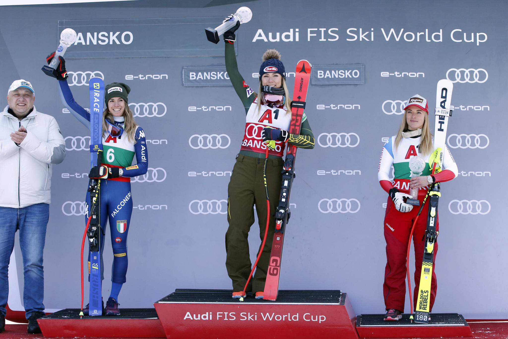 Mikaela Shiffrin, centre, takes her place on the podium ©Getty Images