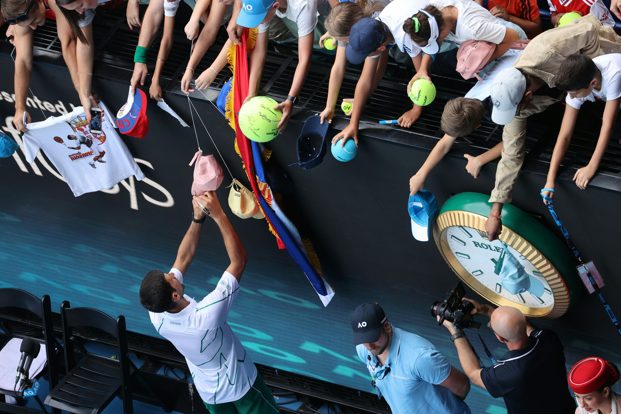 Djokovic signs autographs for fans after his win ©Getty Images