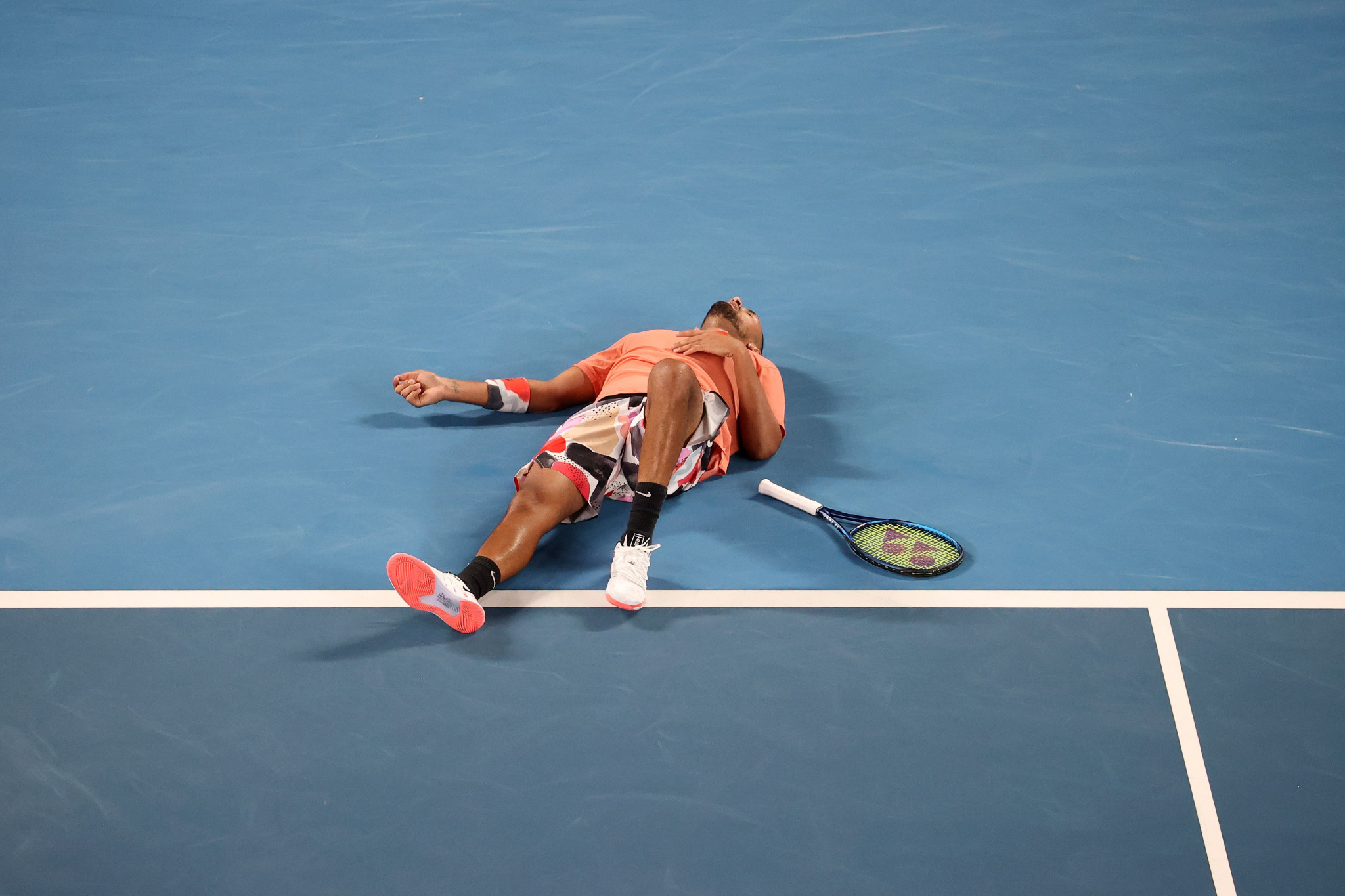 Australia's Kyrgios falls to the floor during his defeat to Nadal ©Getty Images