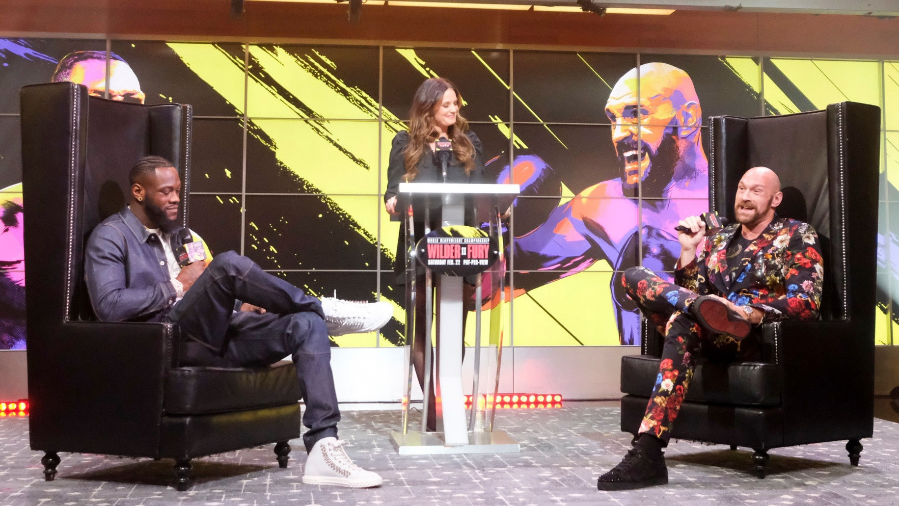 Deontay Wilder and Tyson Fury go head-to-head at a TV event ahead of their heavyweight fight earlier this year - ©AFP