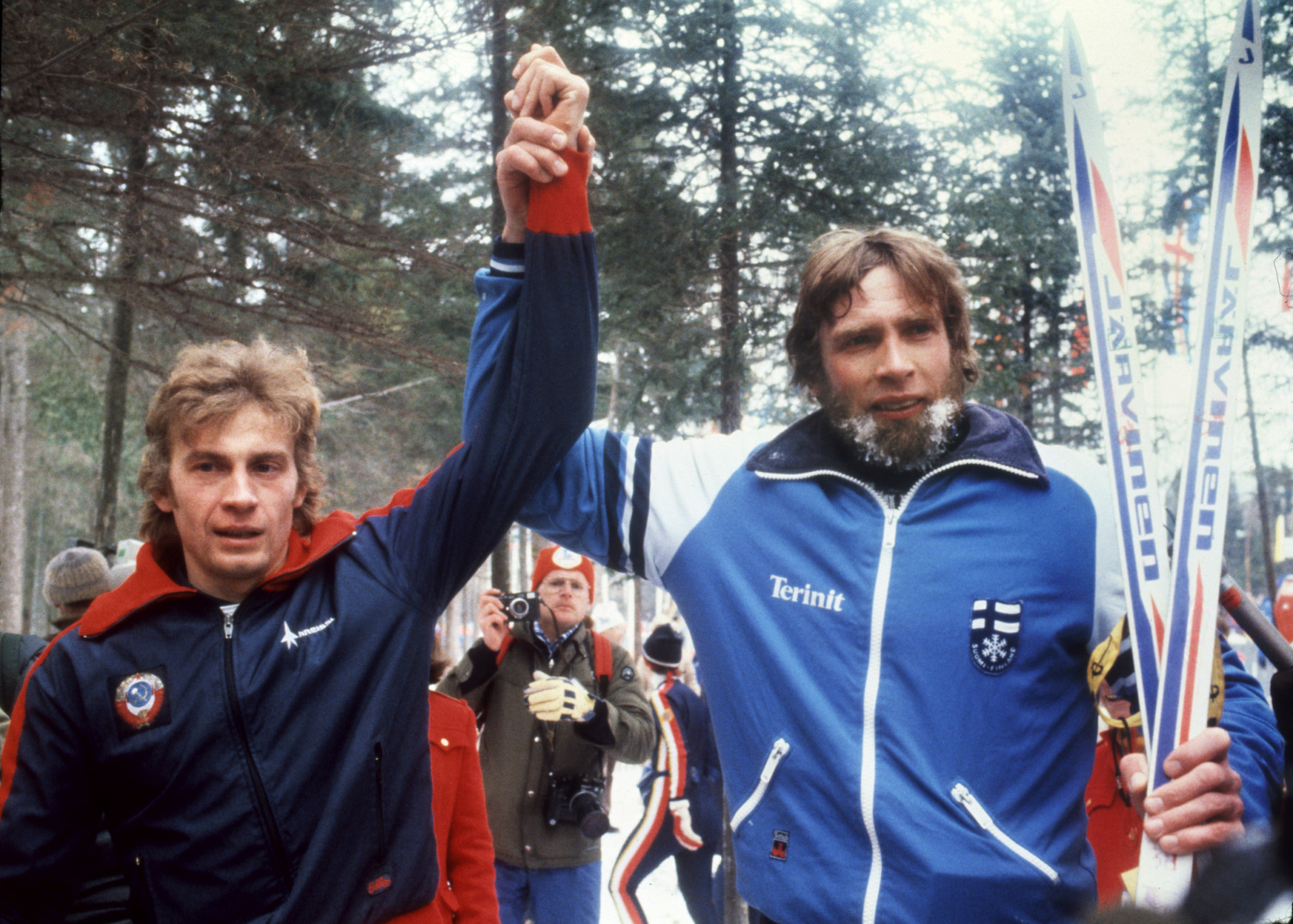The Soviet Union's Nikolai Zimyatov, left, has his arm raised by silver medallist Juha Mieto of Finland after winning one of his three gold medals ©Getty Images
