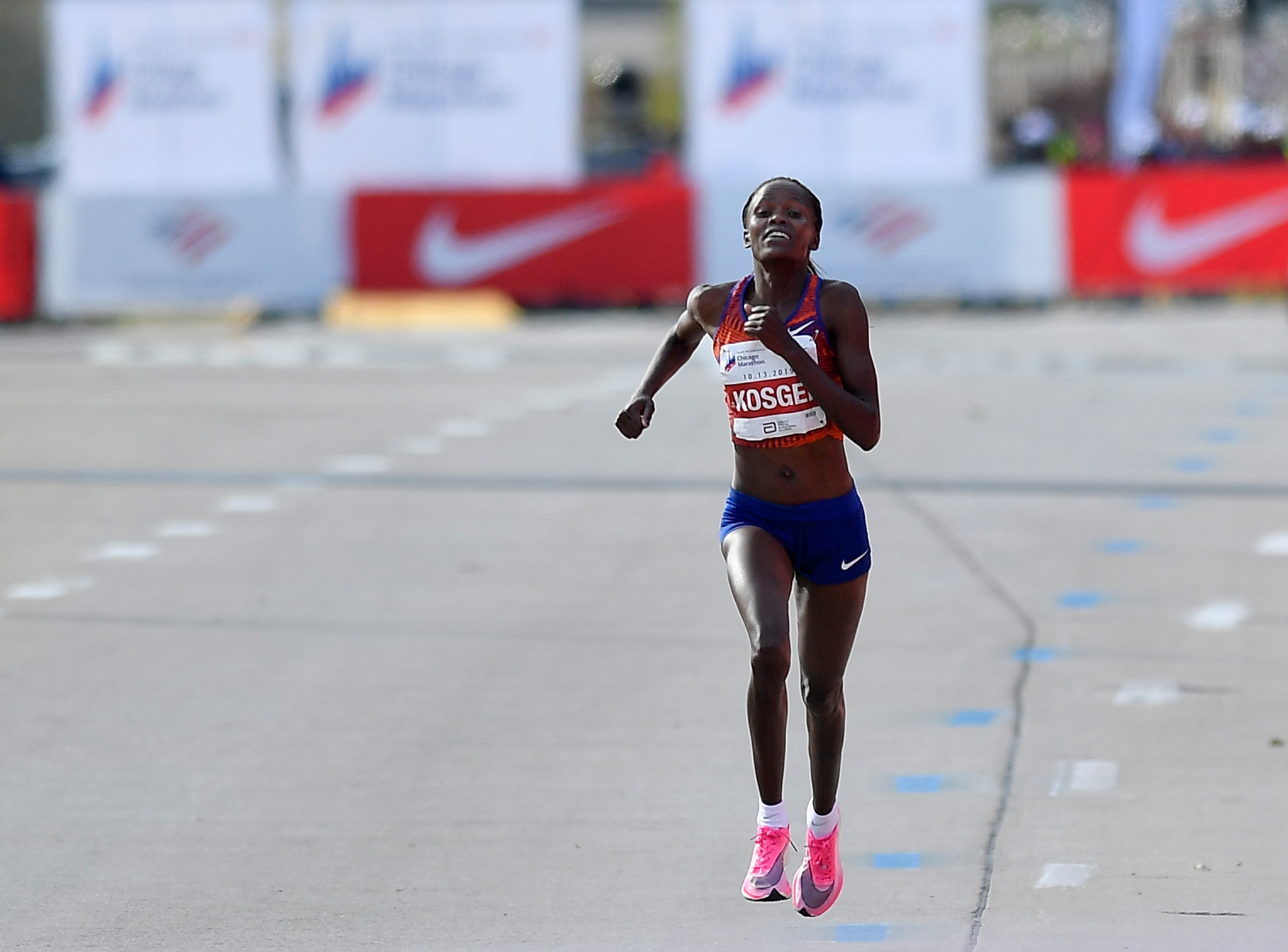 Eliud Kipchoge's countrywoman Brigid Kosgei wore the same Nike model of a shoe in Chicago the day after he ran a sub-two hour marathon to break Paula Radcliffe's 16-year-old world record ©Getty Images