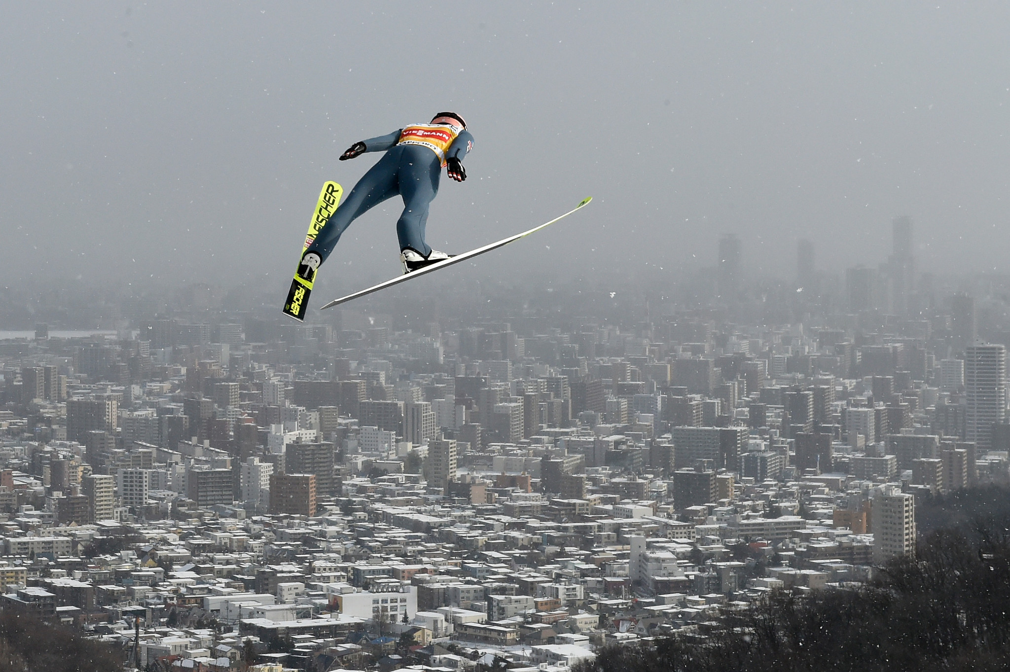 Stefan Kraft won last time out in Sapporo, he is pictured here jumping out towards the city ©Getty Images