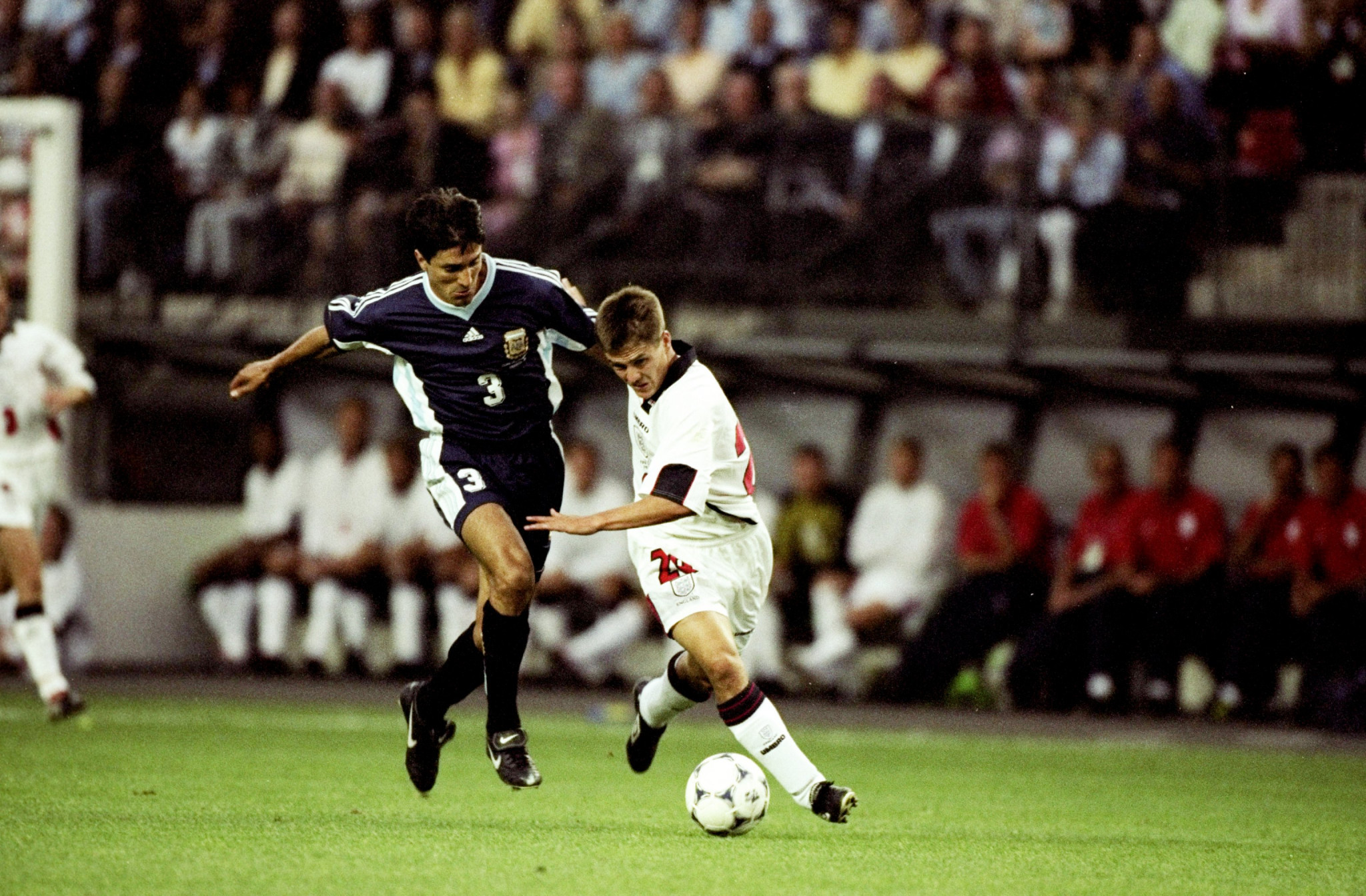 An 18-year-old Michael Owen makes his way past Argentinian defender Jose Chamot en route to scoring the spectacular goal at the 1998 World Cup finals that remains one of the highlights of English footballing history ©Getty Images