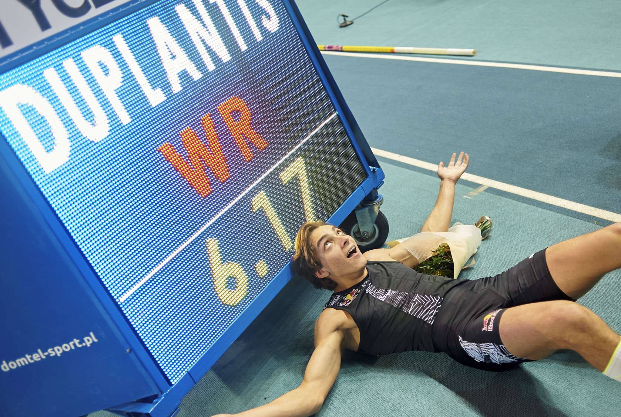 Armand Duplantis in front of the pole vault record height he cleared, aged 20, in Torun, Poland on Saturday night - it promises to be the first of many records for him ©Getty Images