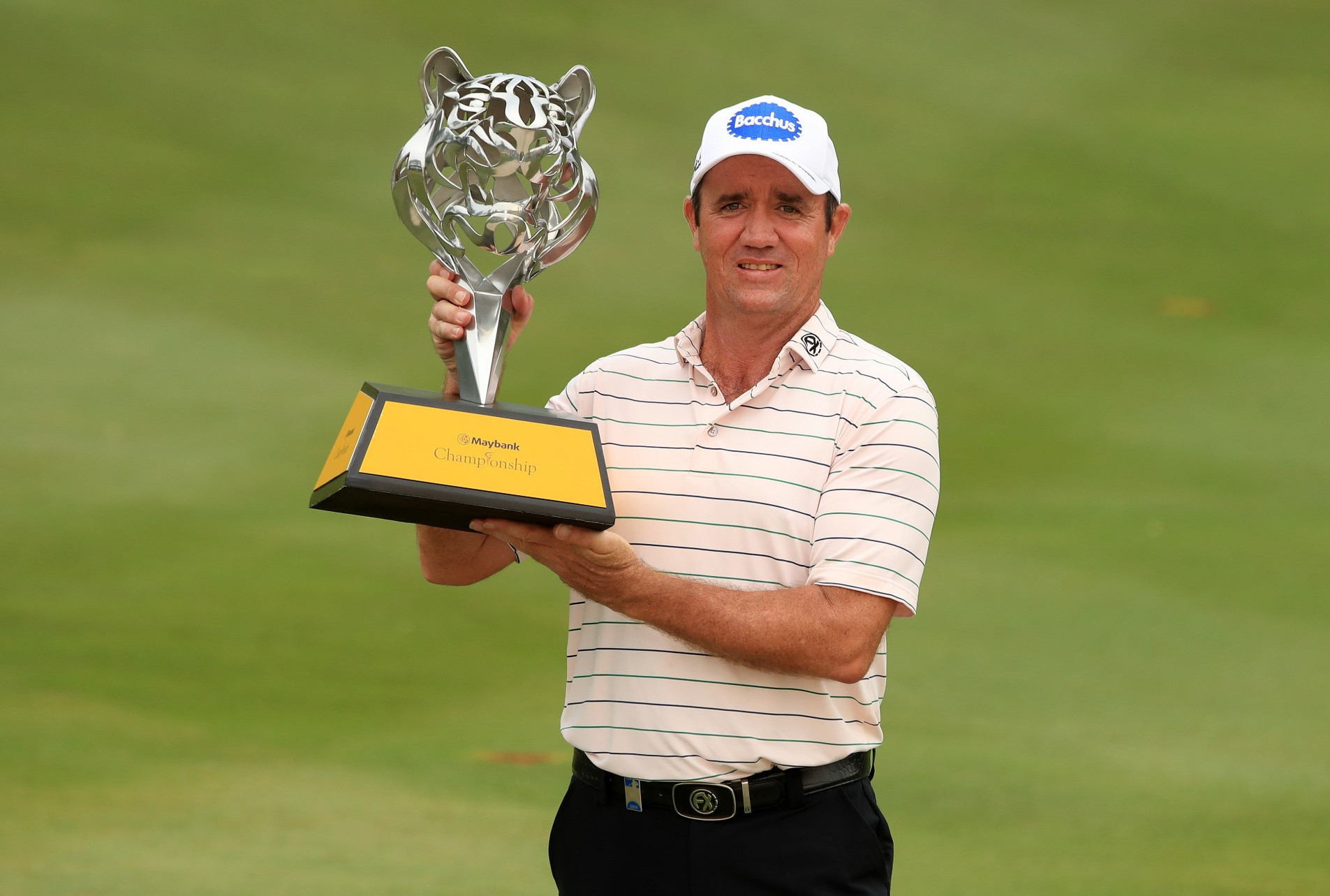 Scott Hend, pictured with the trophy, will not be able to defend the Maybank Championship this year as the event has been postponed due to the coronavirus outbreak ©Getty Images