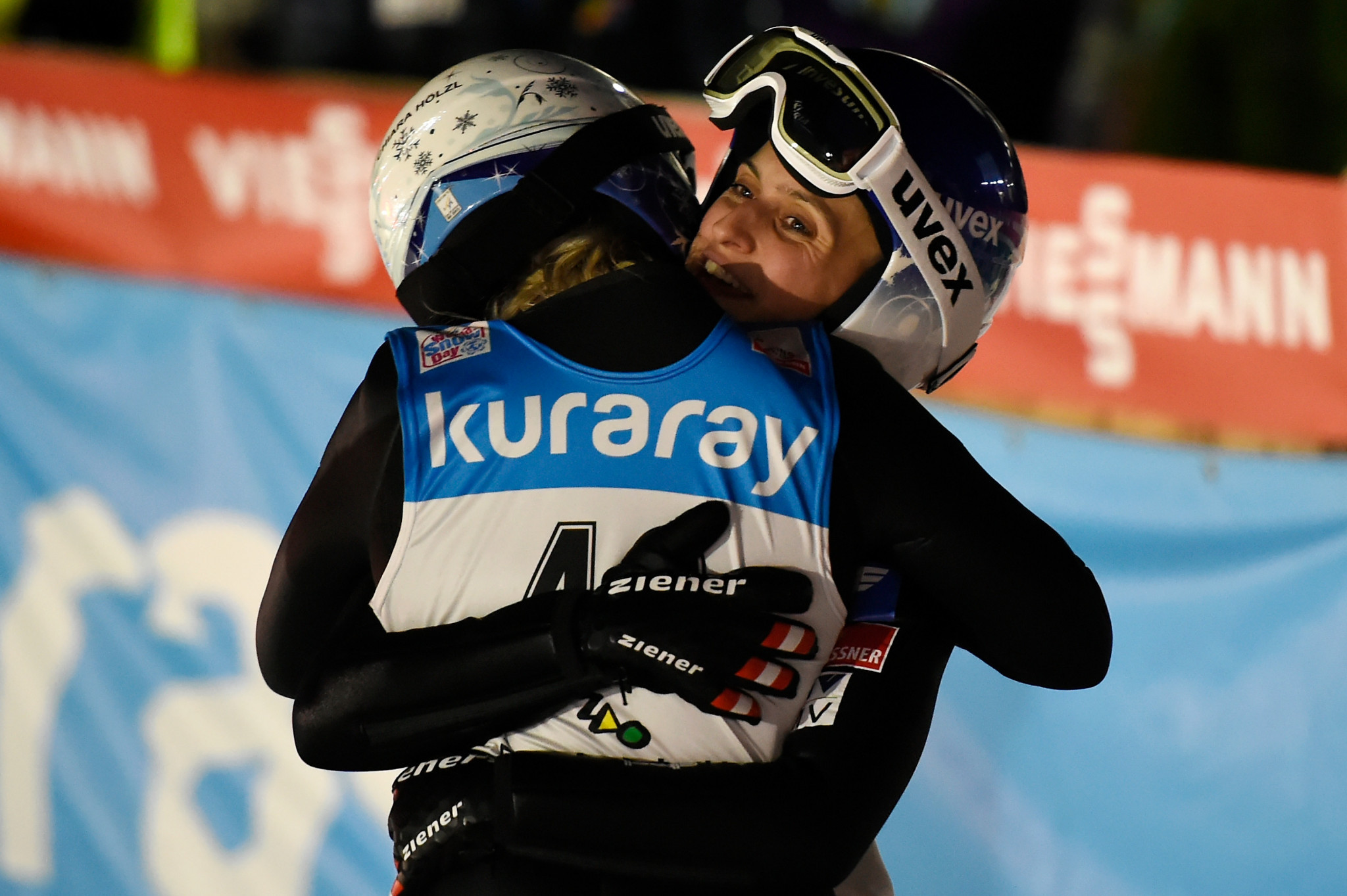 FIS Ski Jumping World Cup rivals Chiara Hölzl and Eva Pinkelnig combined to win the team competition for Austria ©Getty Images