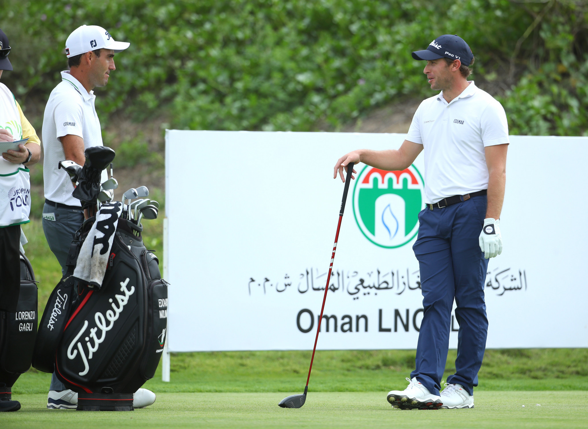 Edoardo Molinari, left, and Lorenzo Gagli chat at the Oman Open after being cleared to play ©Getty Images