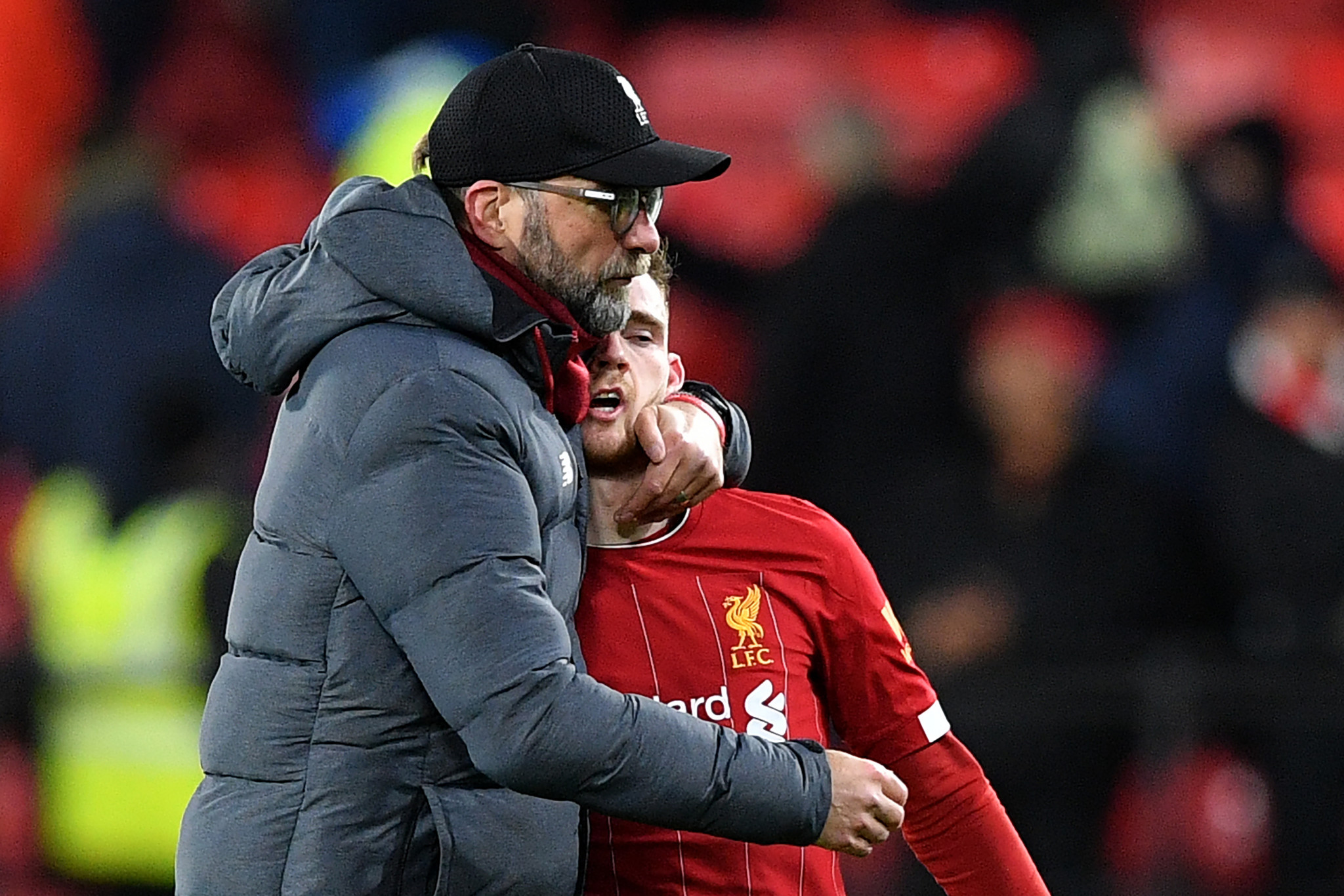 Liverpool manager Jürgen Klopp embraces defender Andrew Roberston after his side's shock 3-0 Premier League defeat at Watford on Saturday ©Getty Images