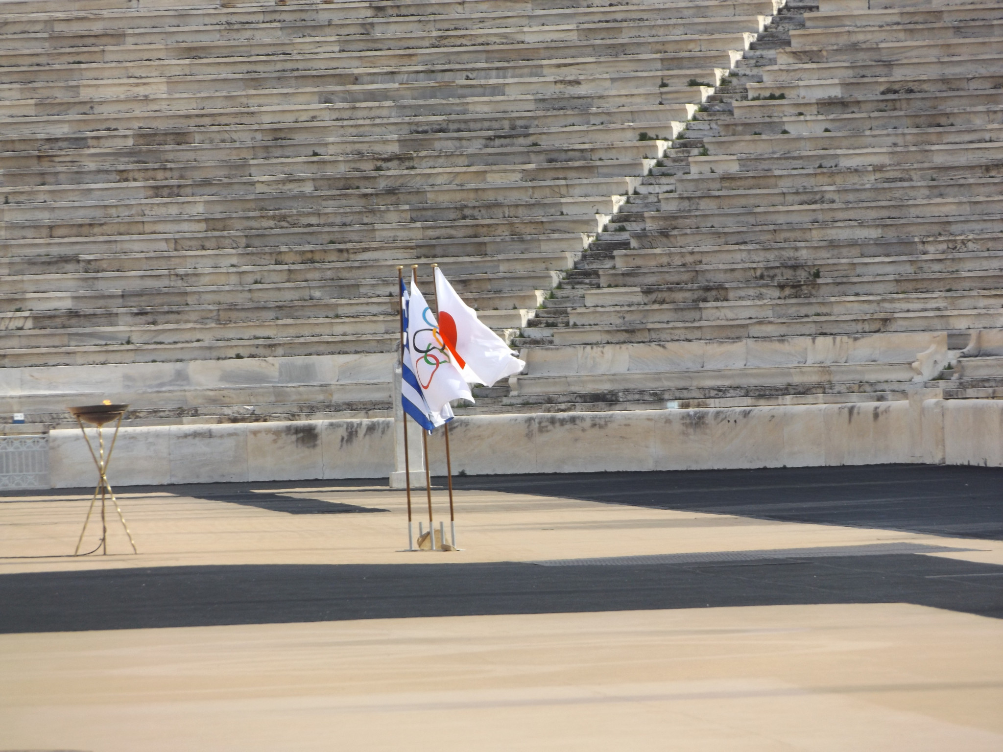 Greek, Japanese and Olympic flags at the Panathinaiko Stadium in Athens ©Philip Barker