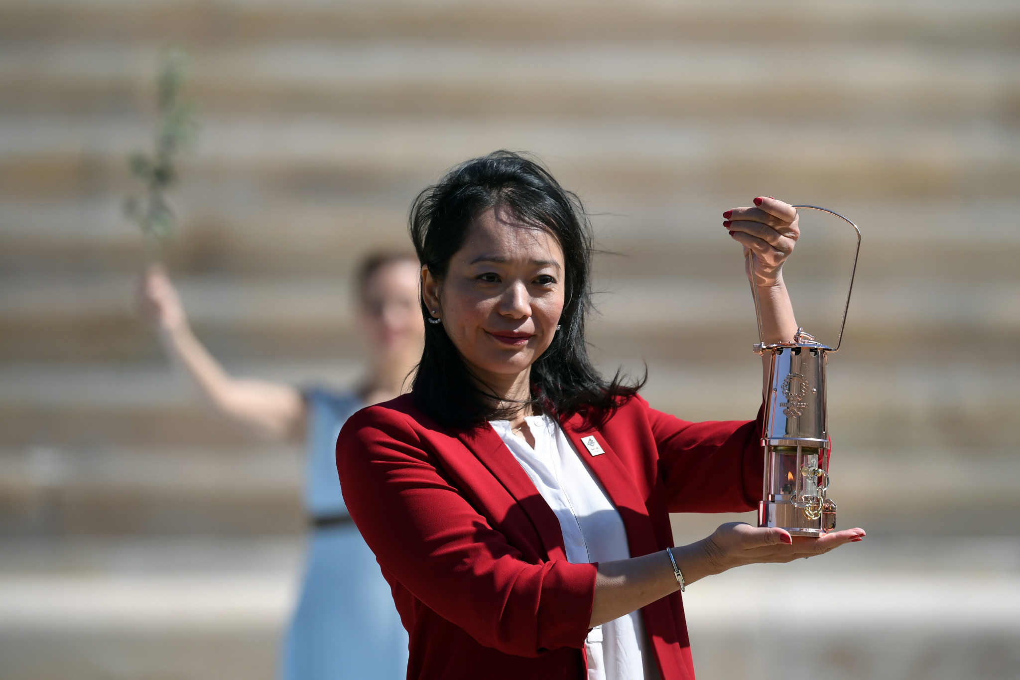 Naoko Imoto poses with the Olympic Flame ©Getty Images