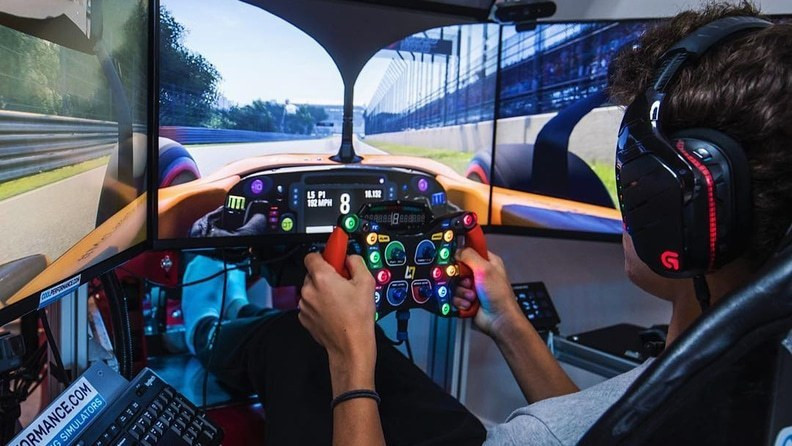 Lando Norris using his driving simulator, is one of the best esports drivers on the grid ©Lando Norris