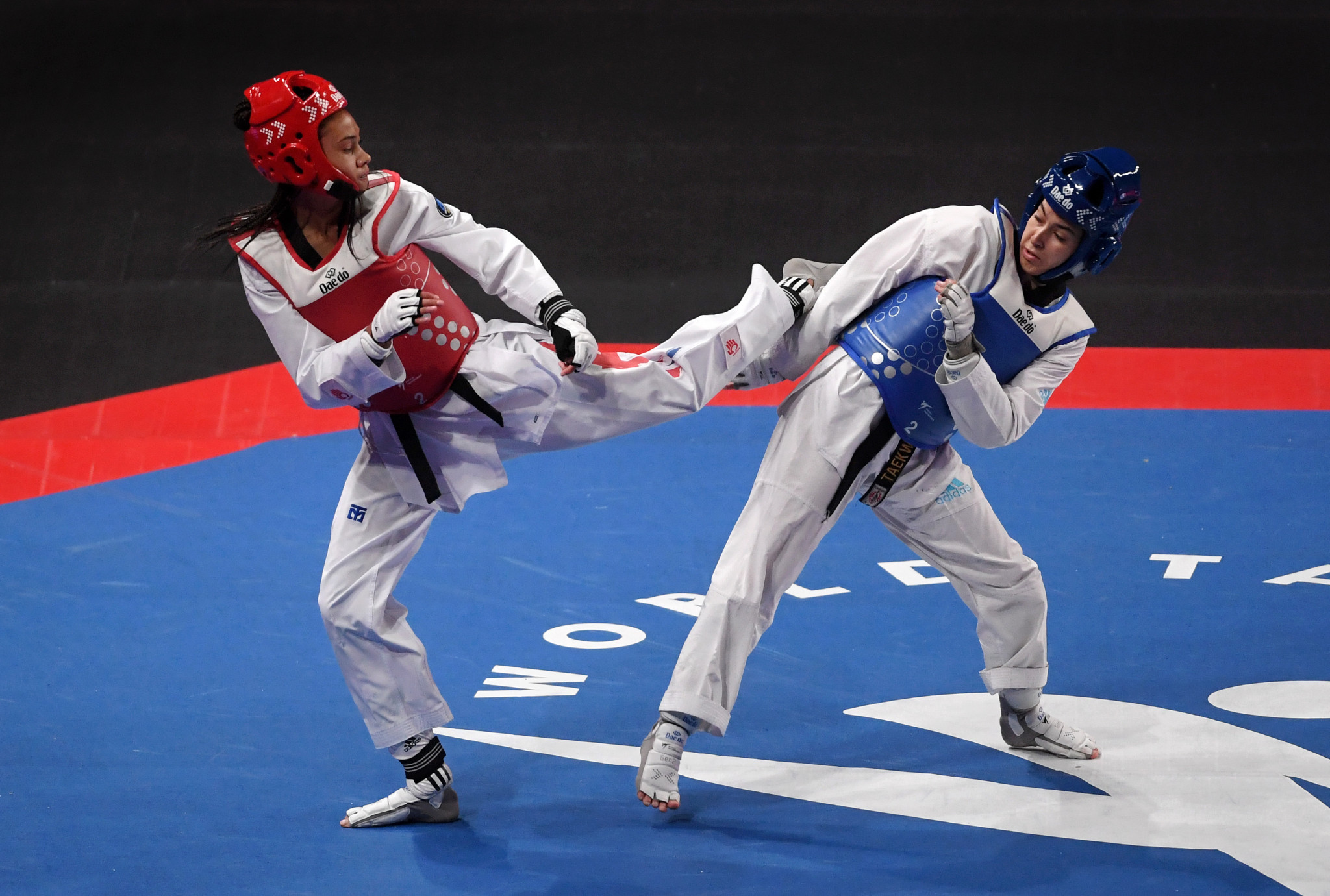 Oumaima El Bouchti, right, in blue, is among the Moroccan taekwondo athletes to have qualified for the rescheduled Tokyo 2020 Olympic Games ©Getty Images  