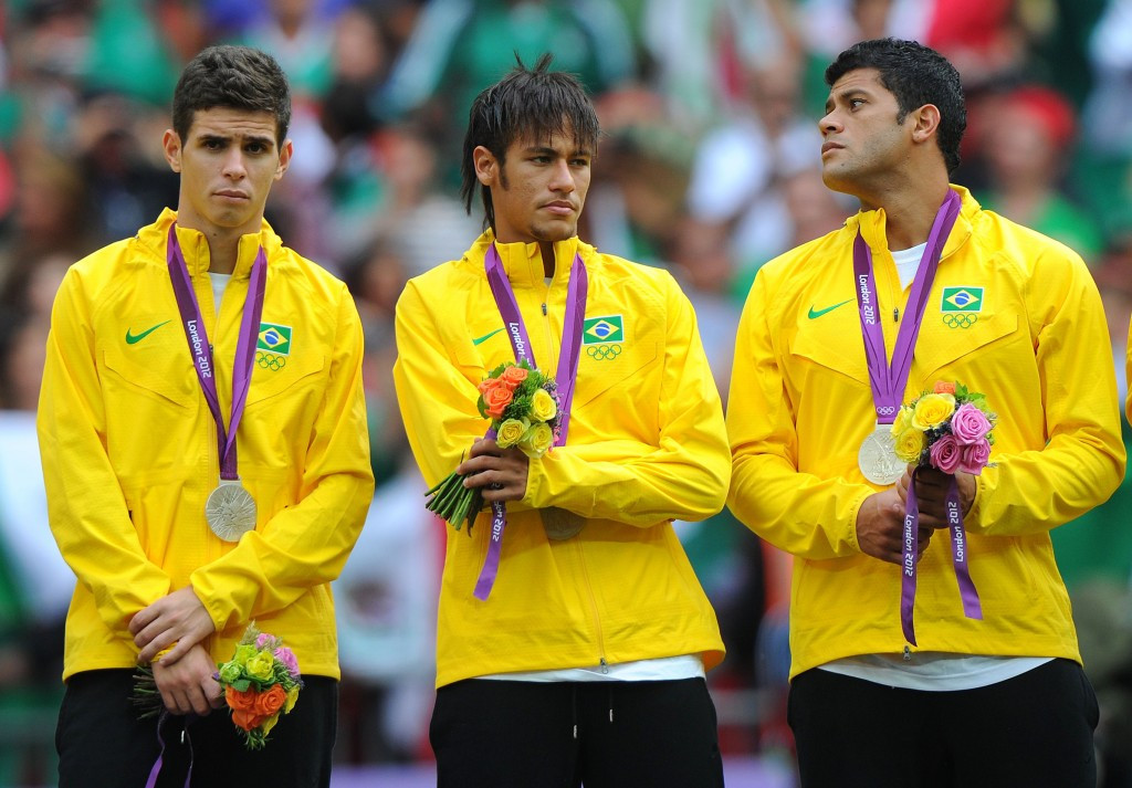 Brazilian stars Oscar, Neymar and Hulk are despondent after only collecting silver medals at London 2012 ©Getty Images