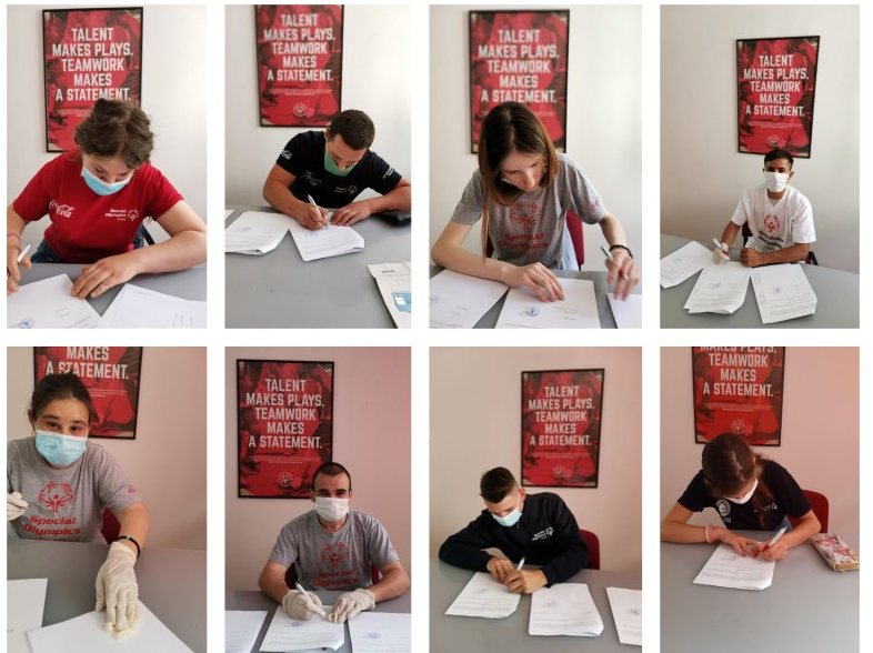 Eight of the 10 Special Olympics Serbia athletes signing their forms ©Special Olympics Serbia