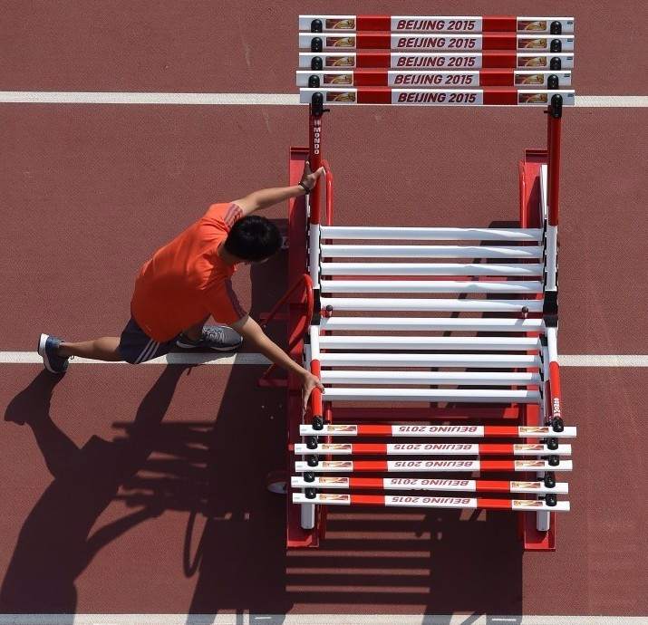 Hurdles being stacked on the Mondo track laid in Beijing for this summer's IAAF World Championships ©Getty Images