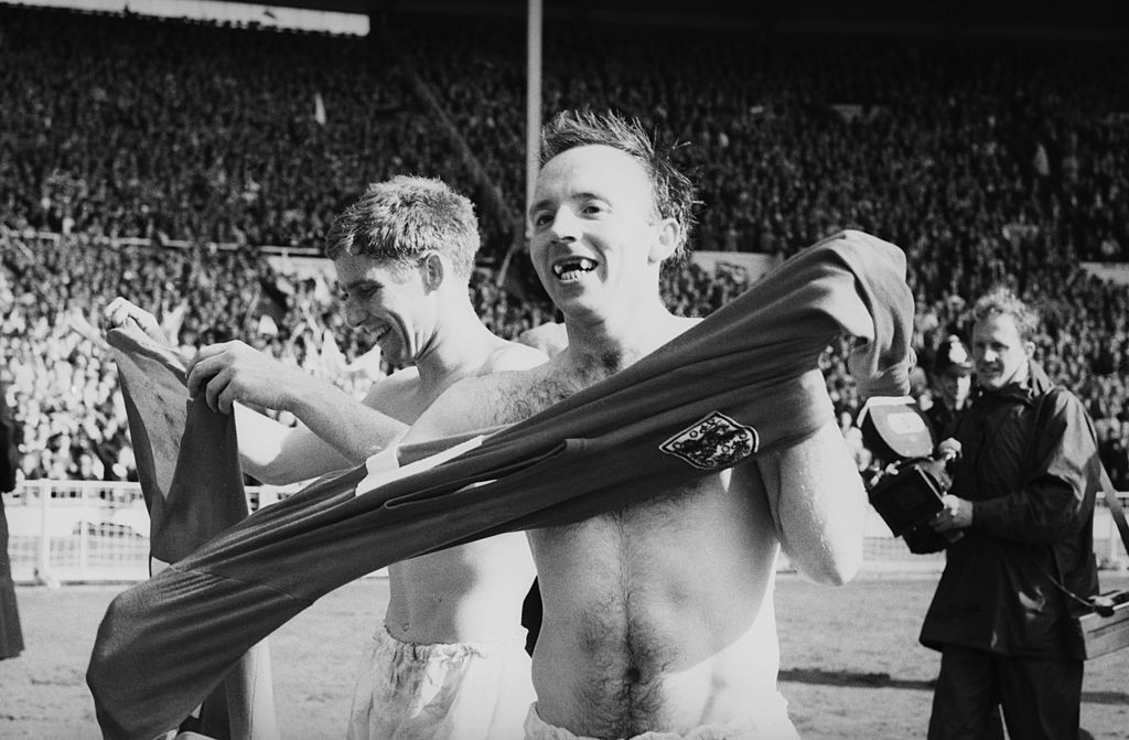 Nobby Stiles, minus front false teeth, celebrates England's exhausting World Cup win over West German at Wembley in 1966 with hyperactive team-mate Alan Ball ©Getty Images