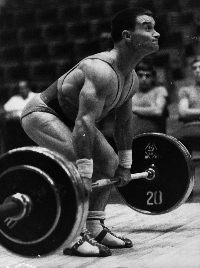 Hungarian weightlifter Imre Foldi in action at the 1968 Mexico Olympic Games. He set a new bantam weight world record of 367.5 kgs to win a silver medal. © Keystone/Getty Images.