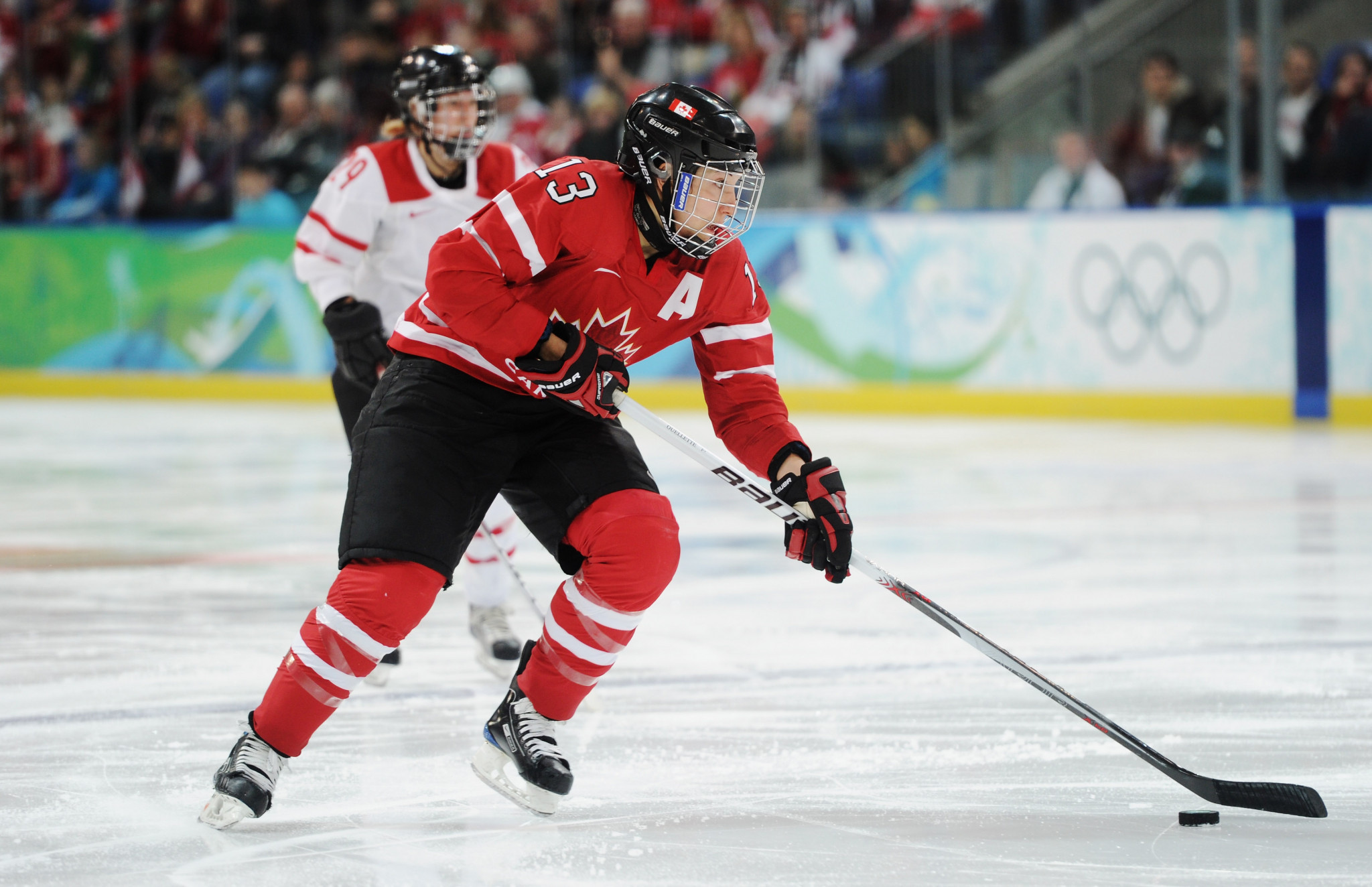Caroline Ouellette helped Canada win four straight women's ice hockey Olympic gold medals from 2002 to 2014 ©Getty Images
