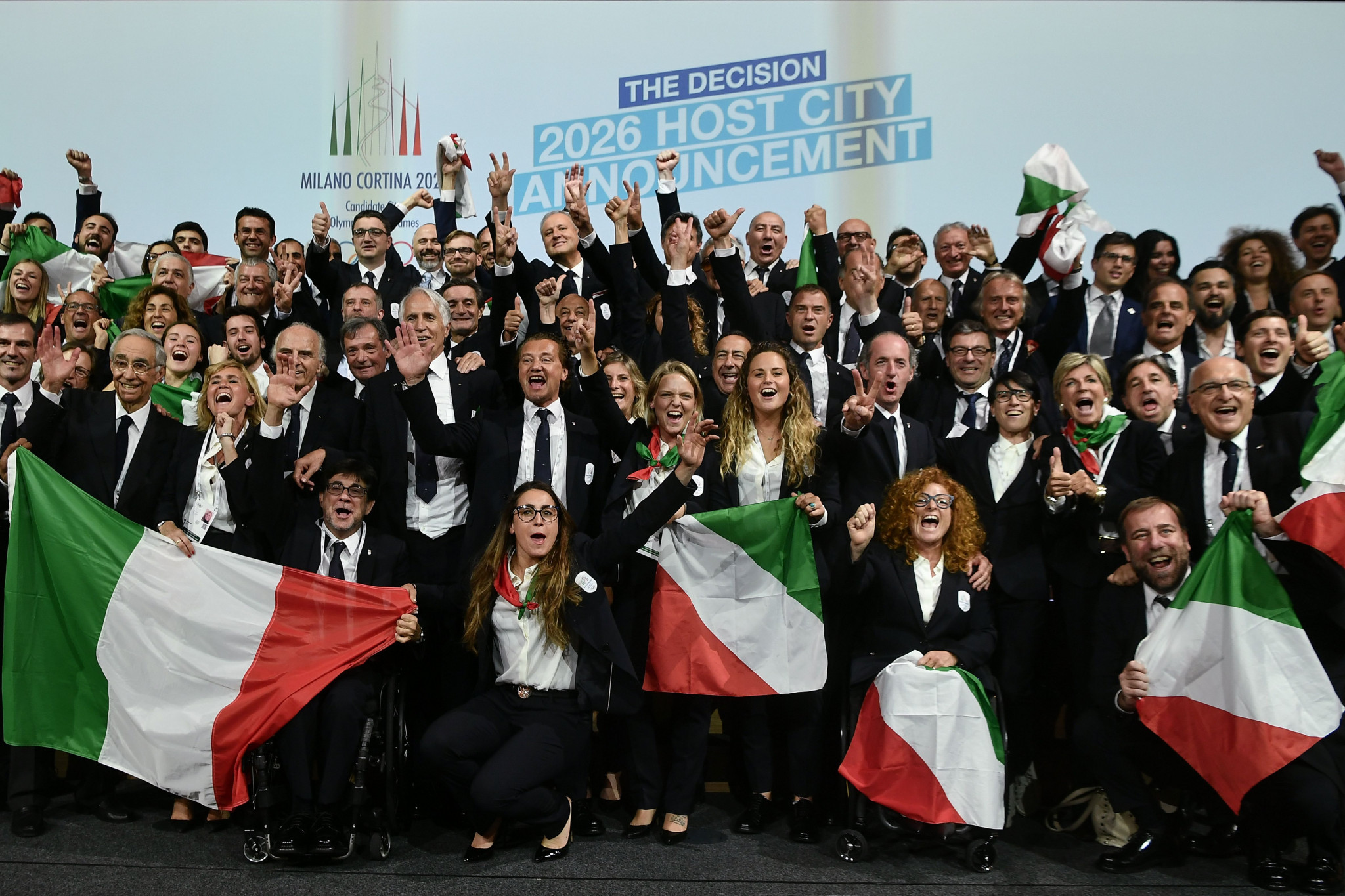 The Italian delegation celebrates winning the bid at last year's IOC Session in Lausanne ©Getty Images