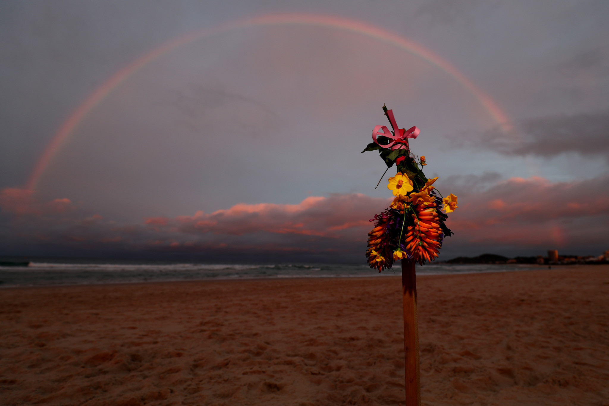 Tributes have already been placed on the beach where Alex Pullin was found ©Getty Images