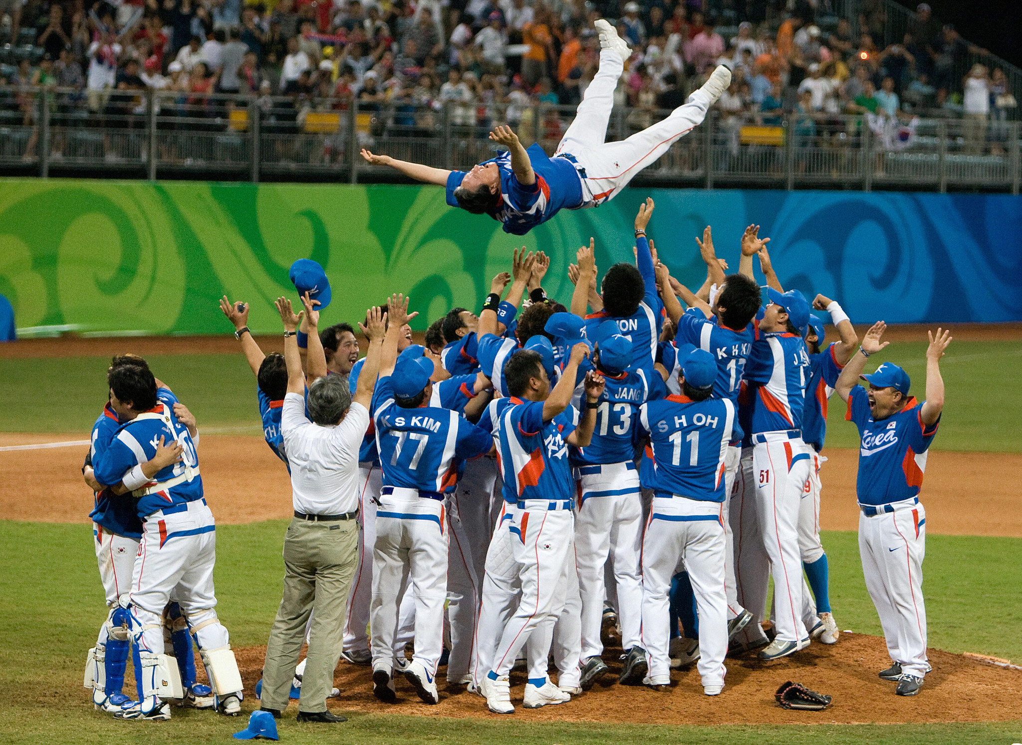 Kim Kyung-Moon is thrown into the air by his players after guiding South Korea to Beijing 2008 gold ©Getty Images