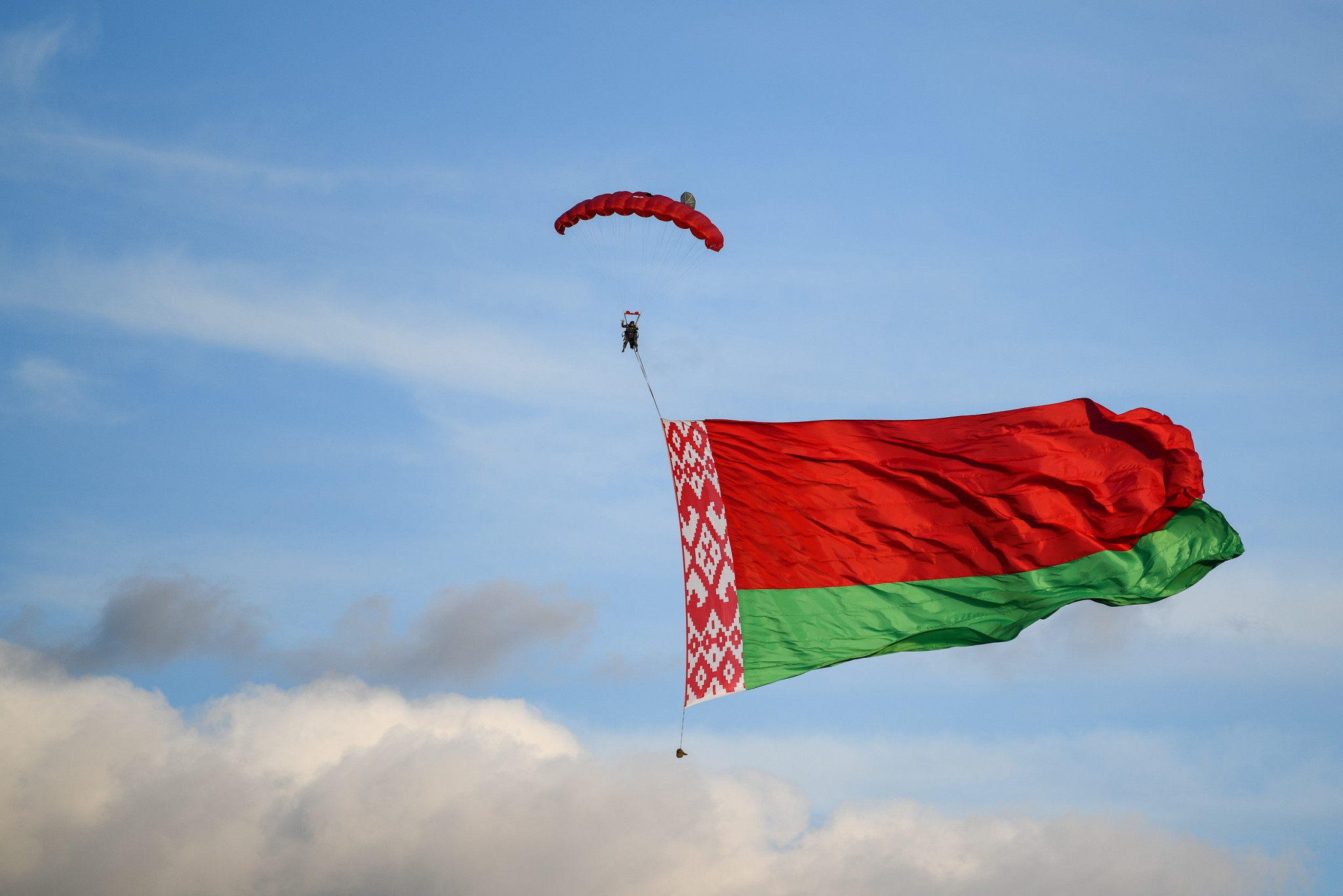 A skydiver displayed the Belarus flag as part of the 