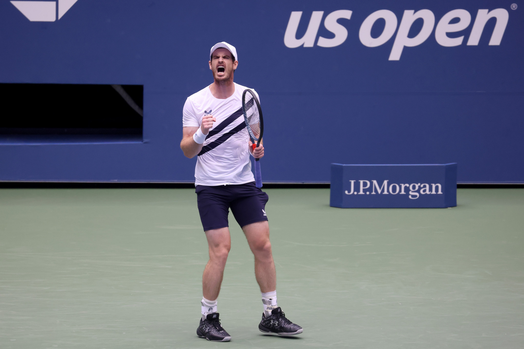 Former champion Murray battles back to win five set thriller on day two of US Open