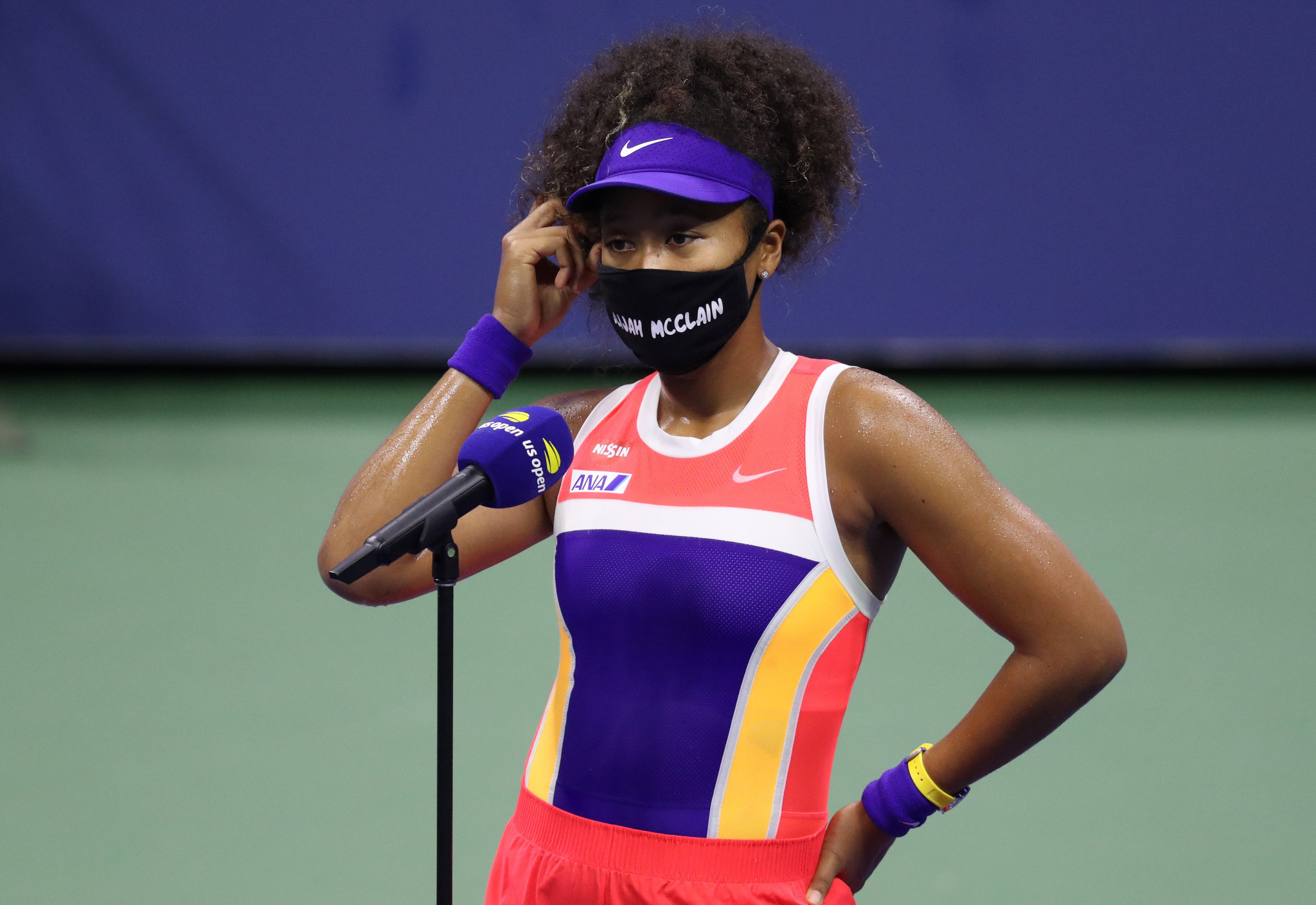 Japan's Naomi Osaka, wearing one of her collection of facemasks, is interviewed after her round two win ©Getty Images