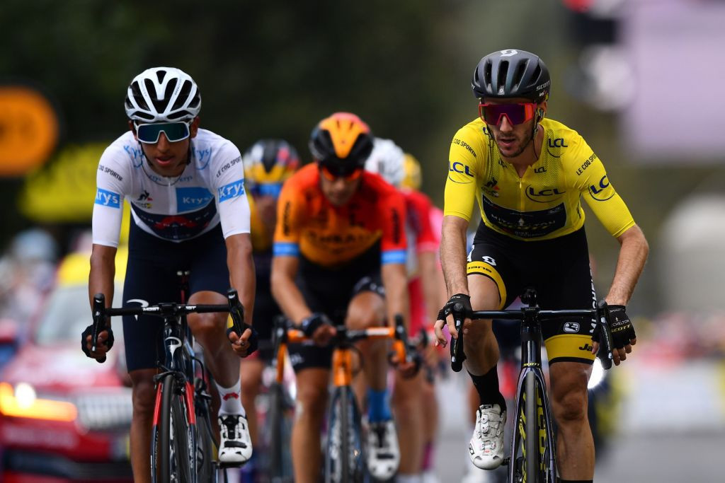 Yates fights off rivals to stay in yellow at Tour de France