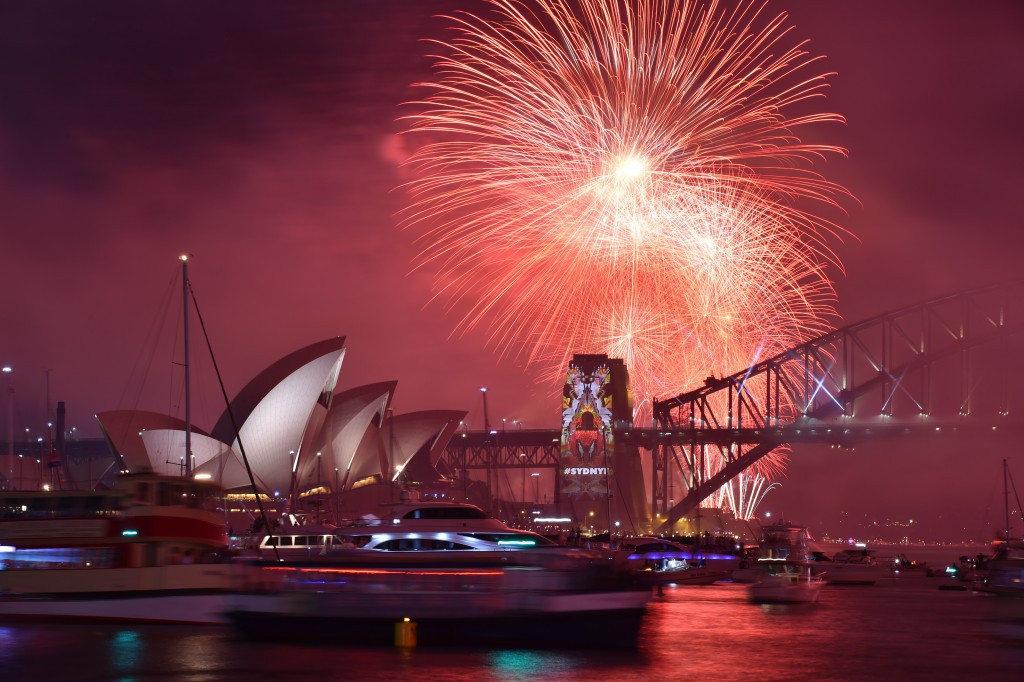 New Year's Eve fireworks erupt over the iconic Harbour Bridge in Sydney, which staged the 2000 Olympics, and Opera House during the traditional fireworks show ©Getty Images
