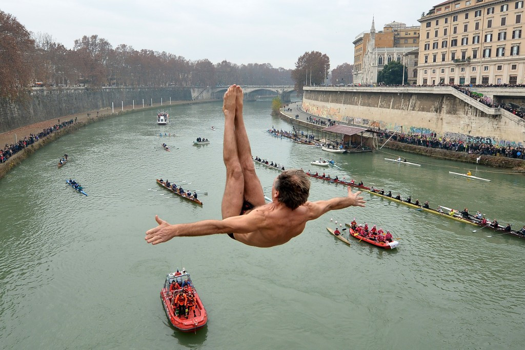 Marco Fois dives in the Tiber river as part of the traditional New Year's celebrations in Rome, which hosted the 1960 Olympics and is bidding for 2024 ©Getty Images