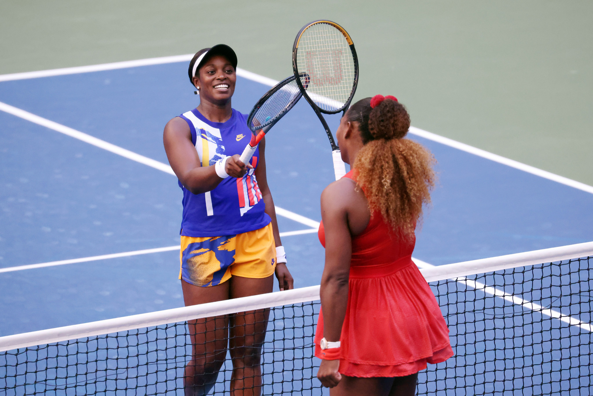 Serena Williams, in red, kept alive her hopes of a 24th Grand Slam with victory over fellow American Sloane Stephens to reach the last 16 of the US Open in New York City ©Getty Images