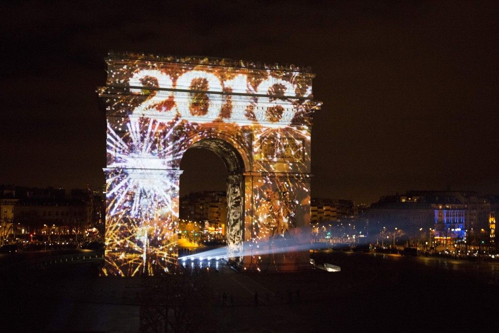 Art work is projected on Arc de Triomphe during a sound and light show part of New Year's celebrations on the Champs-Elysees avenue in Paris, which is hoping to celebrate the centenary of hosting the 1924 Olympics by staging the 2024 edition ©Getty Images