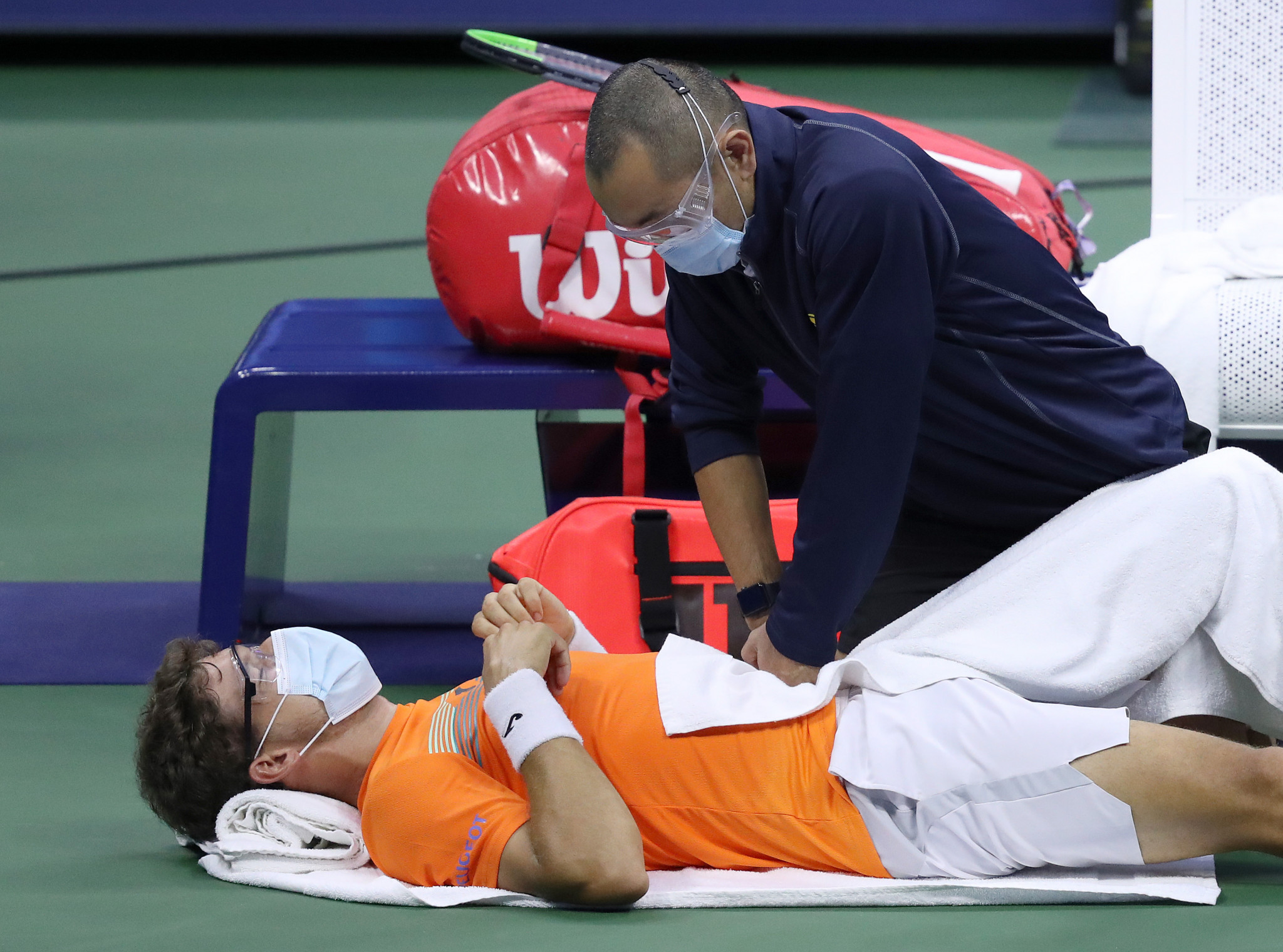 Pablo Carreno-Busta received treatment from the trainer as he lost his semi-final to Alex Zverev ©Getty Images