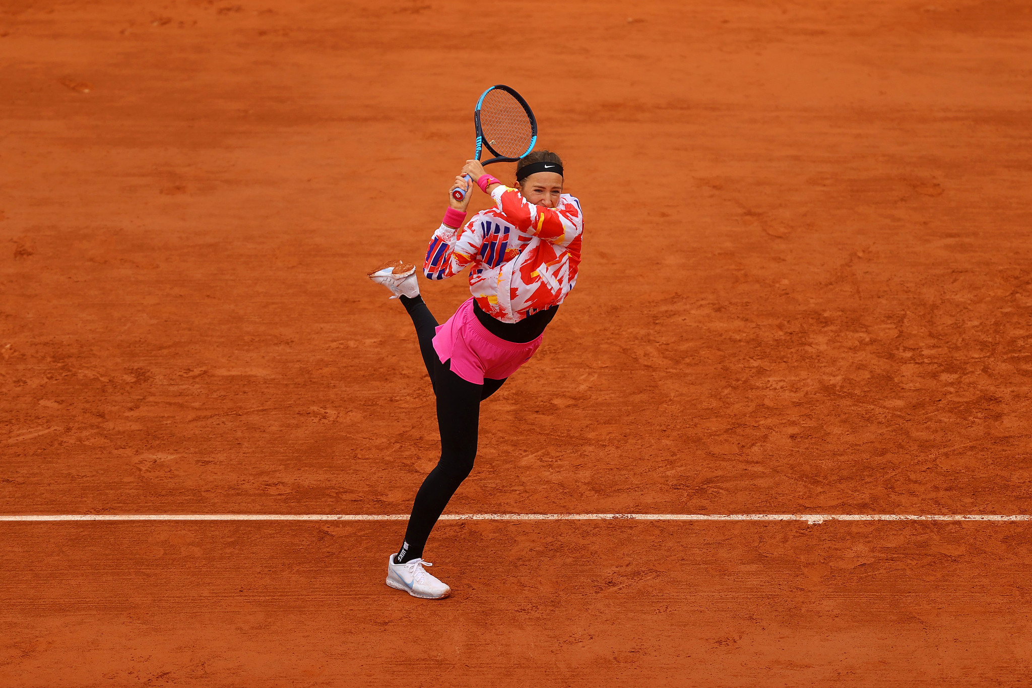 Victoria Azarenka, who was wrapped up on a chilly day in Paris, is through to round two ©Getty Images