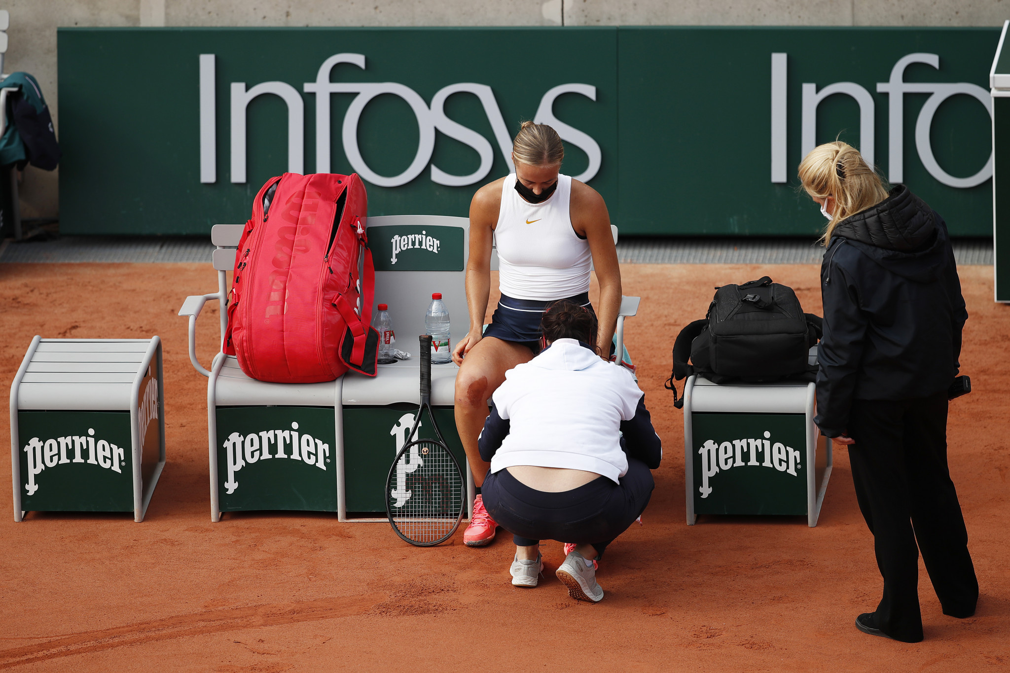 Anna Karolina Schmiedlova receives treatment from the physio, but it did not stop her upsetting Victoria Azarenka ©Getty Images