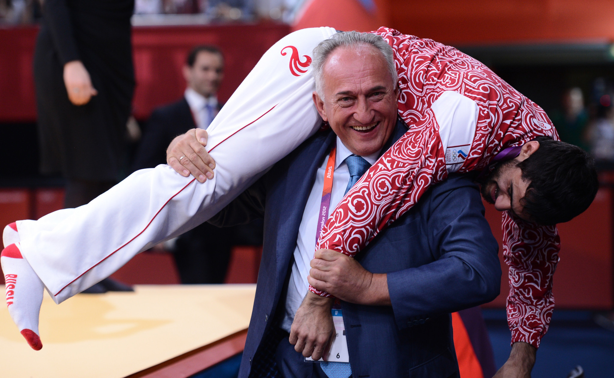 Vasily Anisimov celebrates with Arsen Galstyan after his Olympic gold medal in the under-60kg category at London 2012
