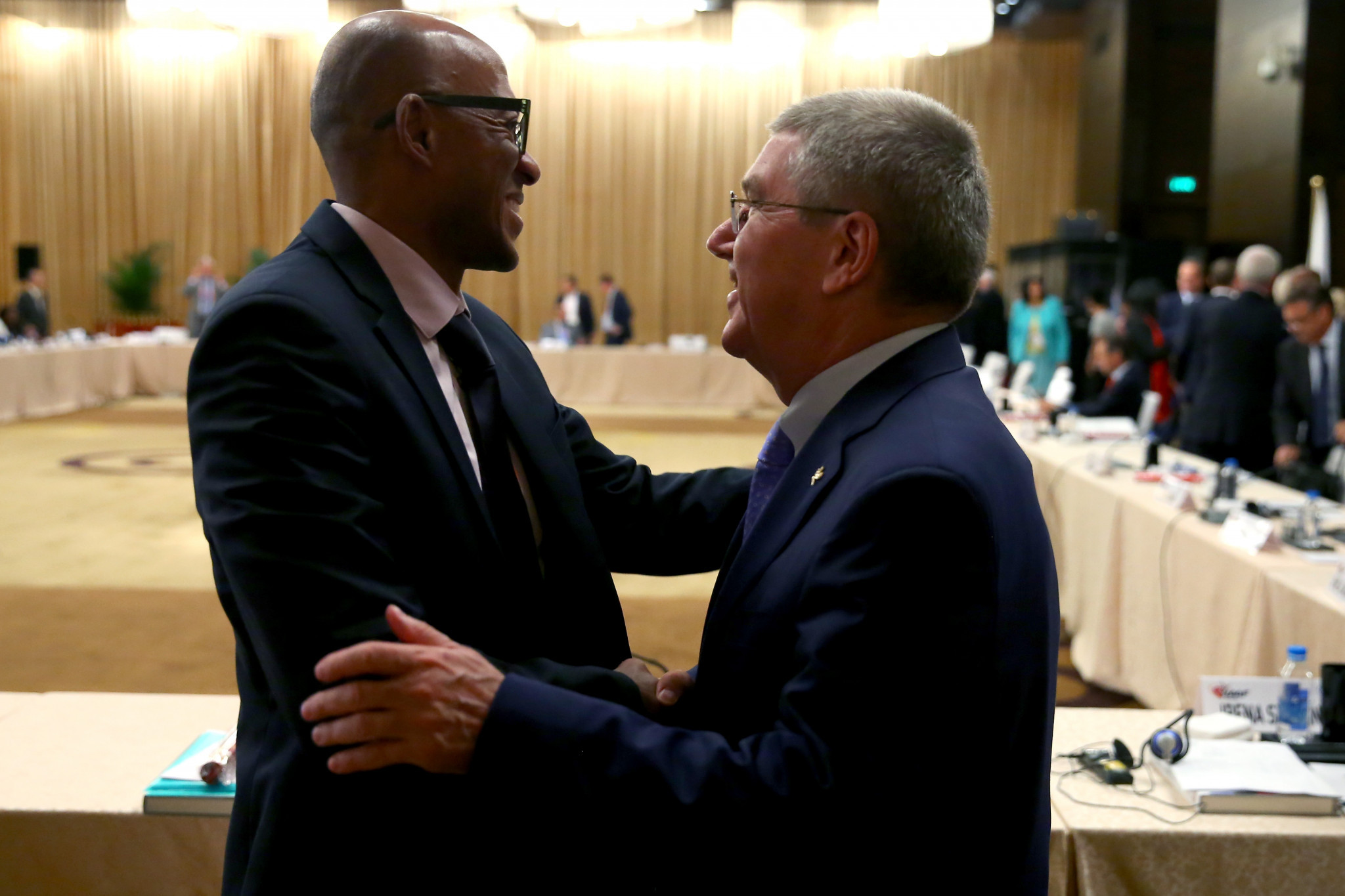 Frankie Fredericks, left, had been appointed to head the IOC Evaluation Commission for the 2024 Olympics by Thomas Bach, right, but was forced to step down after being accused of accepting bribes ©Getty Images