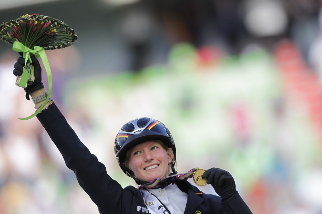 Germany's Sandra Auffarth celebrating becoming the fifth woman to win the world eventing title at Normandy in 2014, following in the footsteps of four British women, including Zara Phillips ©Getty Images