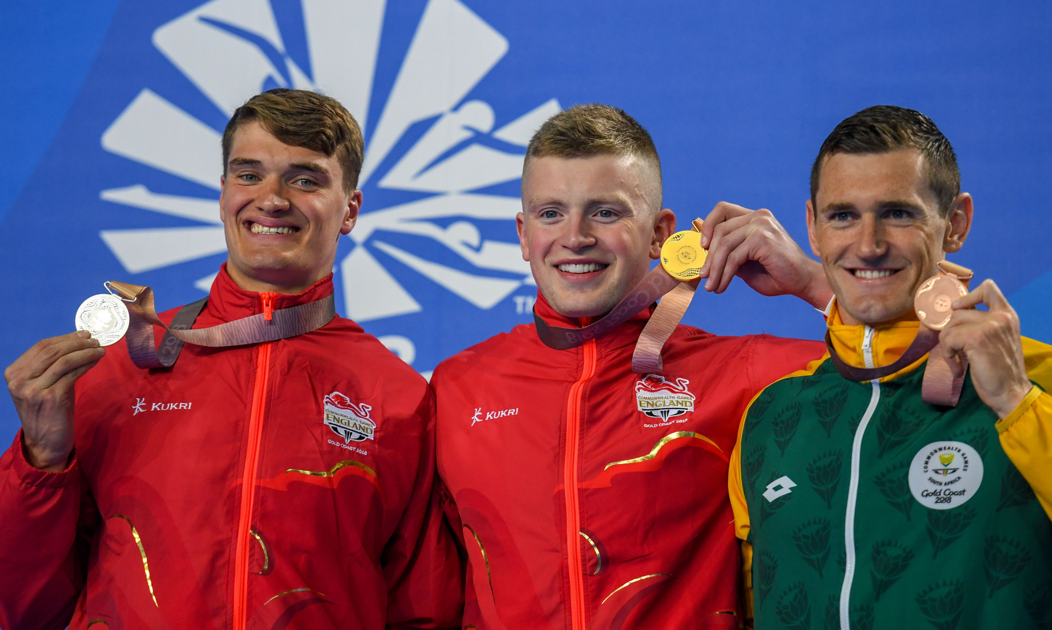 James Wilby, left, and Adam Peaty, centre, on the podium at the 2018 Commonwealth Games ©Getty Images