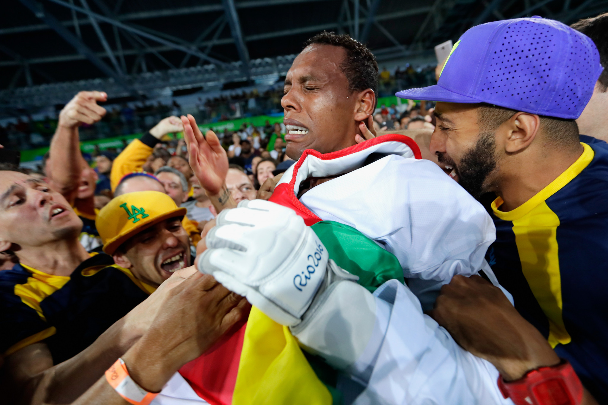 Maicon de Andrade Siqueira is mobbed as he celebrates a medal at his home Olympics ©Getty Images