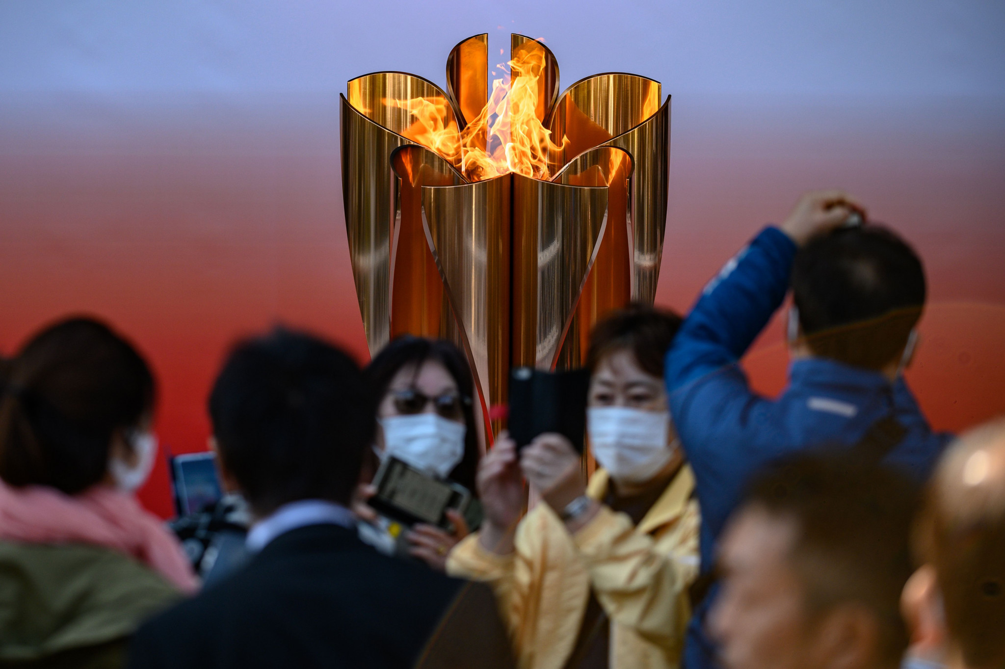 Large crowds defied fears over coronavirus to visit the Olympic flame at Sendai station in Tokyo when it was put on display in March ©Getty Images