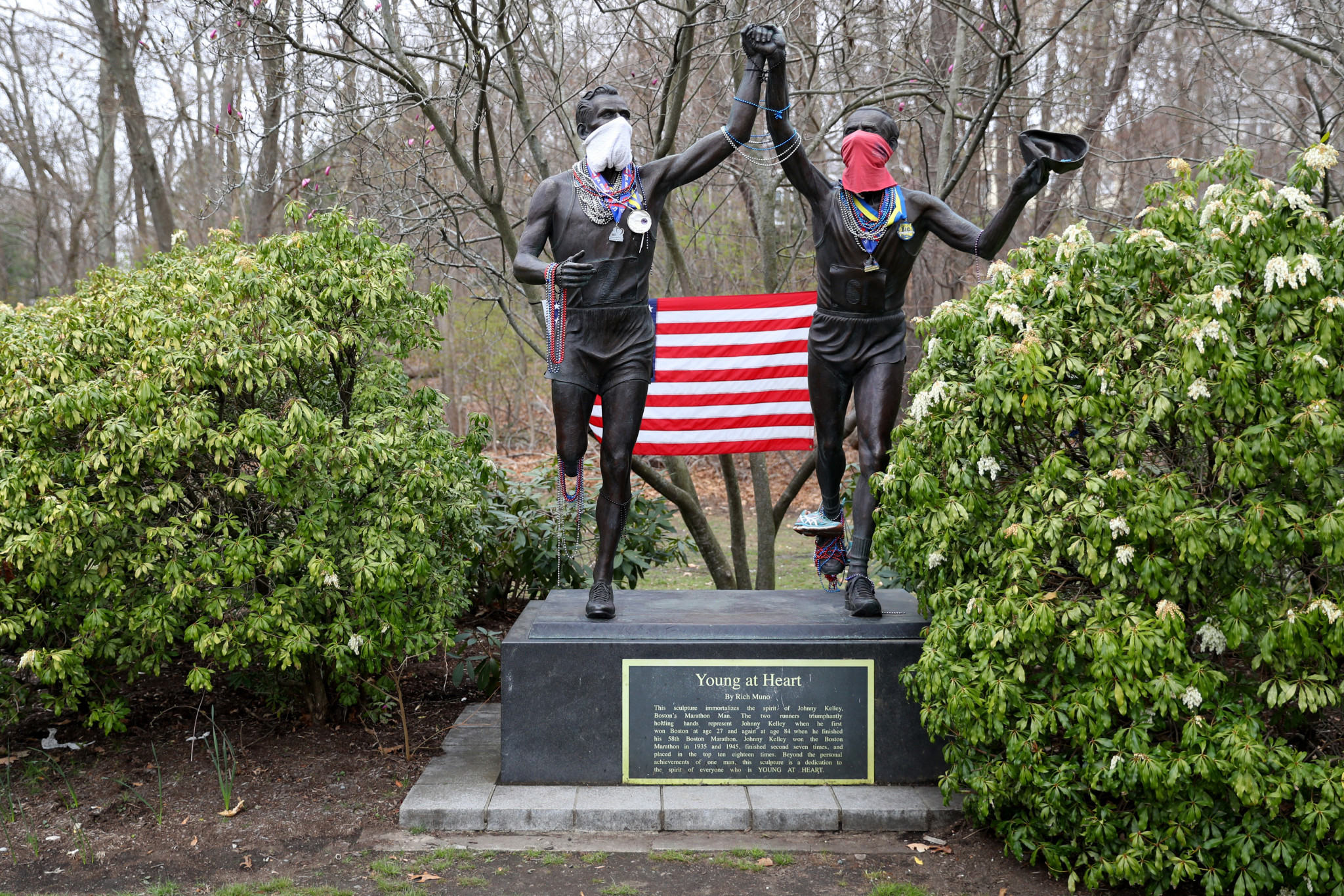 Face coverings were added to the statue of Johnny Kelley on the Heartbreak Hill section of the Boston Marathon course this year ©Getty Images