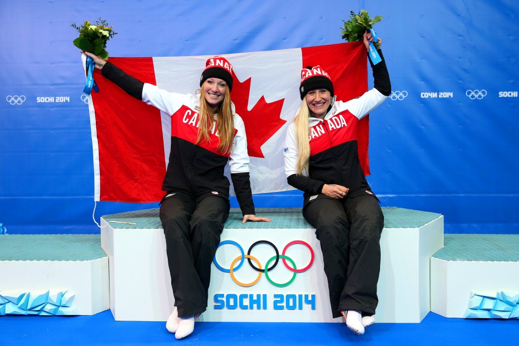 Kaillie Humphries (right), pictured celebrating after winning gold at Sochi 2014, was unable to beat men's teams today ©Getty Images