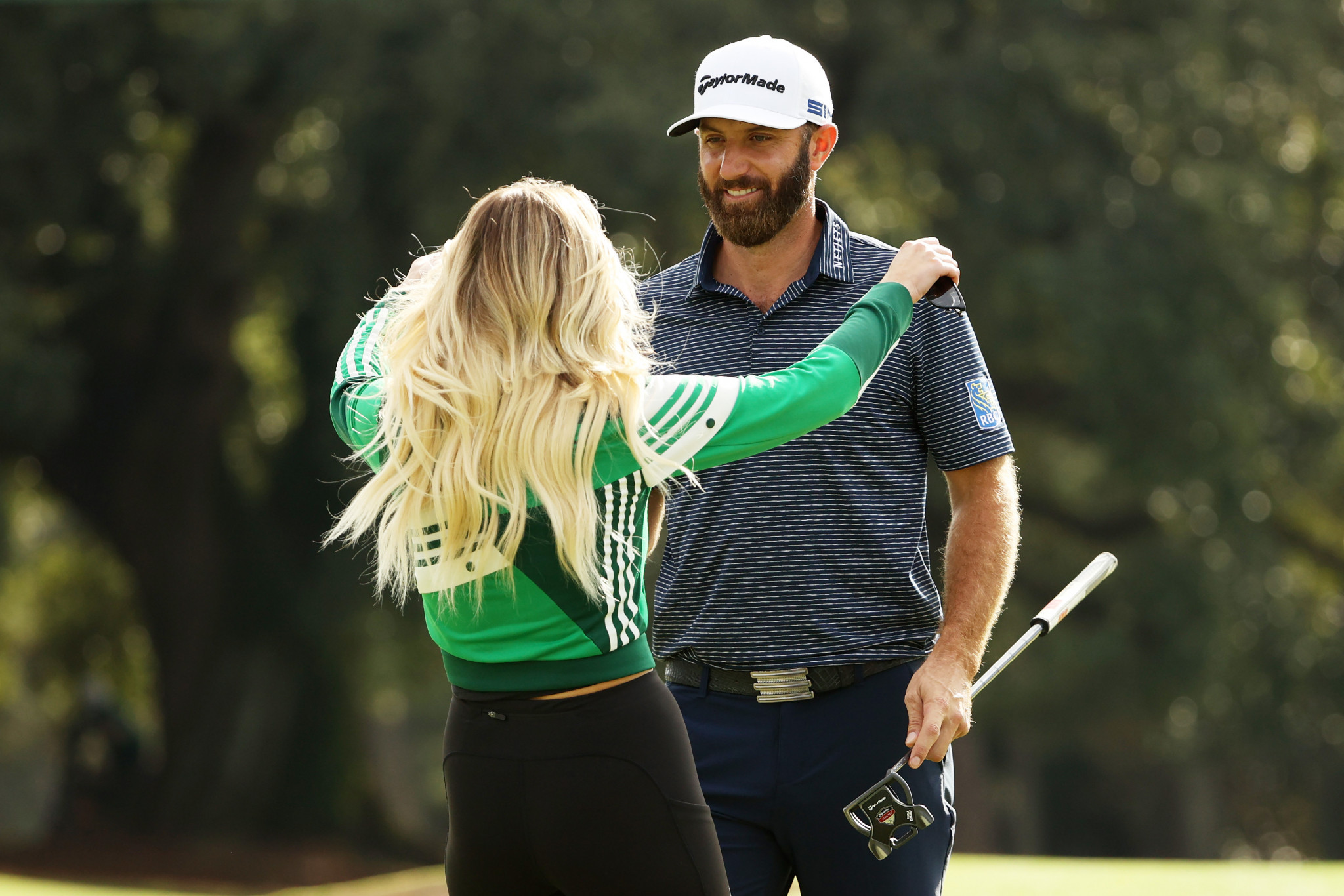 Johnson celebrates his Masters triumph on the 18th green with fiancee Paulina Gretzky ©Getty Images
