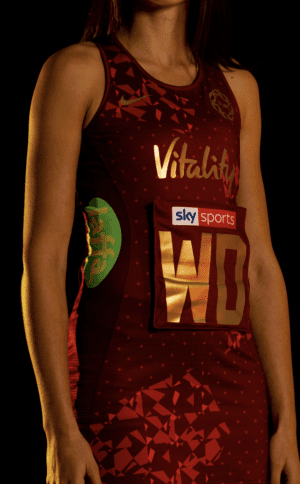 England's new netball kit is designed in red and gold ©England Netball